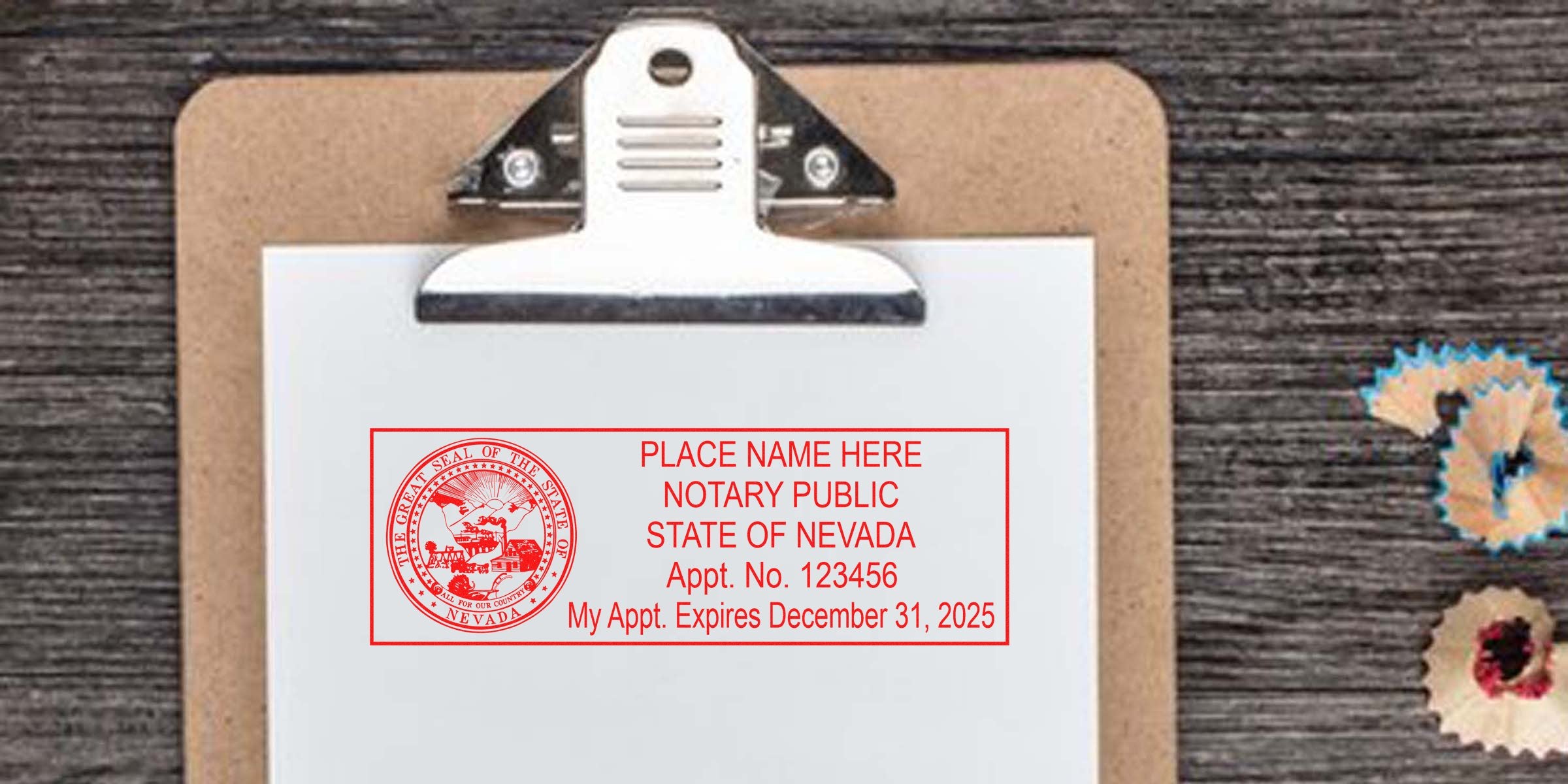 Top-down view of clipboard with white paper featuring a red Nevada notary public stamp and appointment info, on a dark wood desk with colorful pencil shavings.