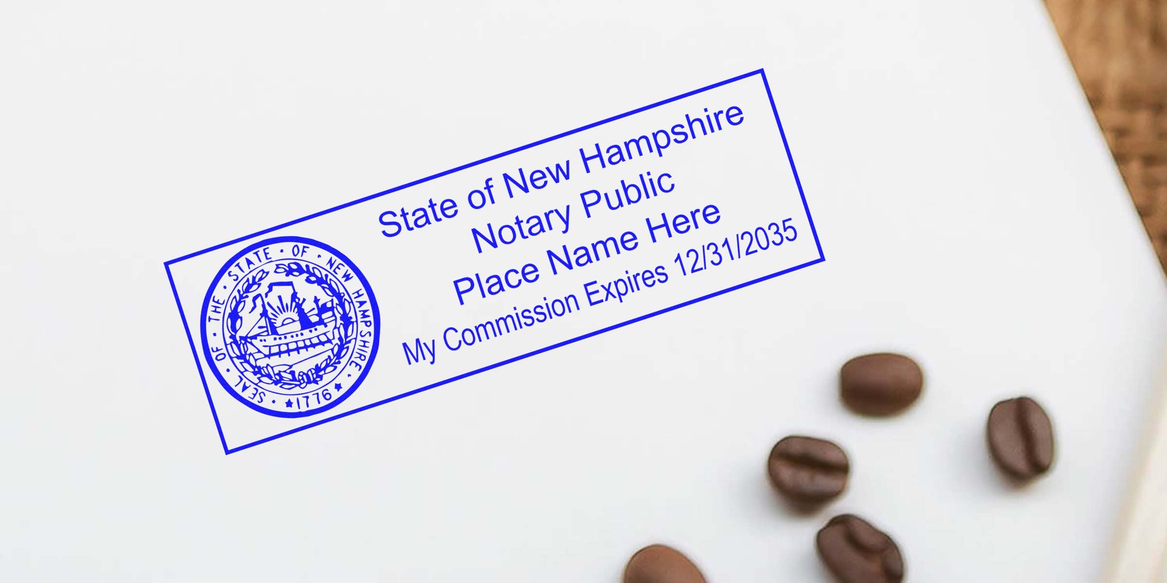 Blue State of New Hampshire notary public stamp mockup on white paper with circular state seal and commission expiry date text, coffee beans nearby