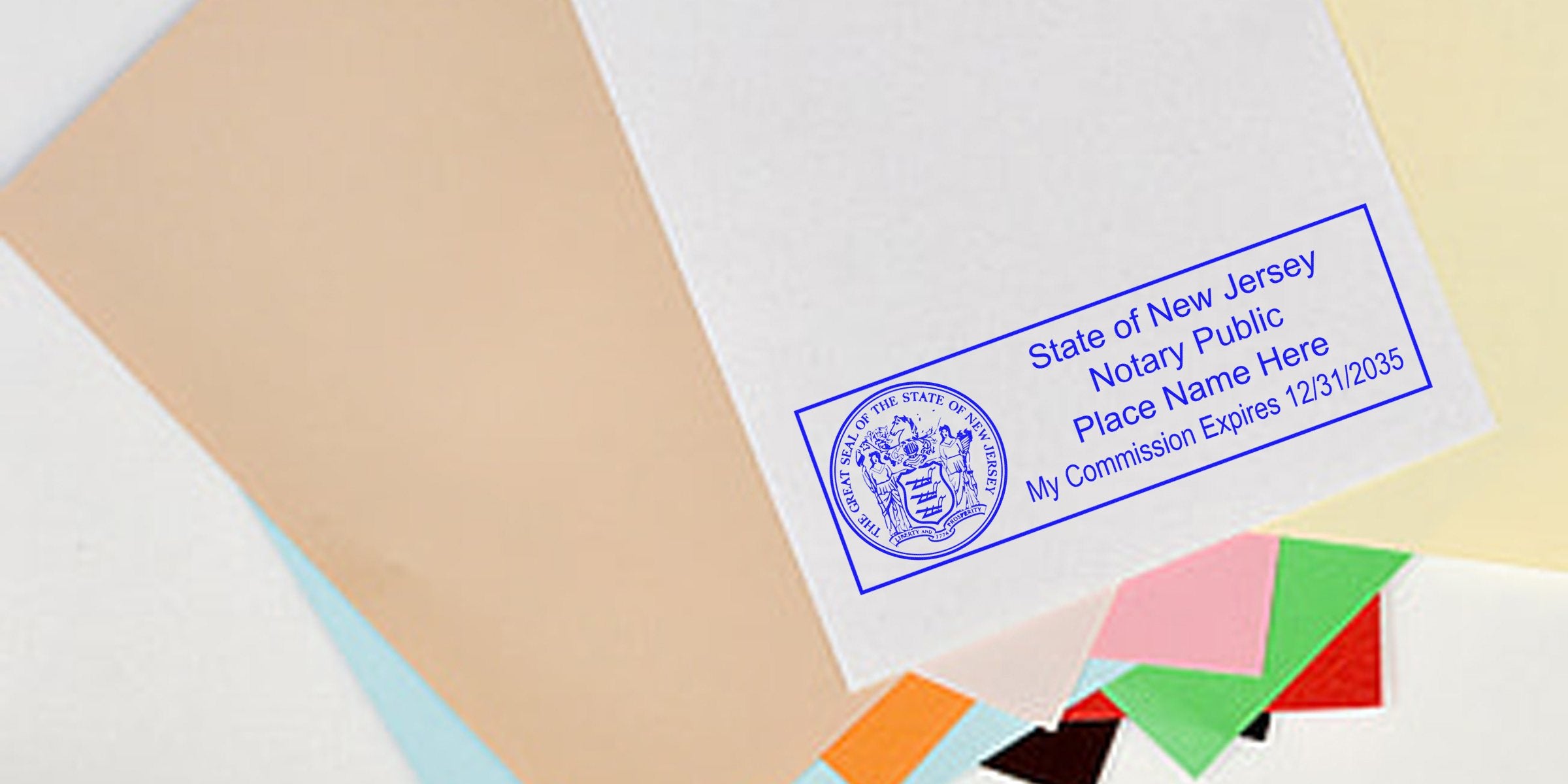 Blue New Jersey notary public stamp on stacked pastel papers and colorful envelopes, mock commission stamp reading "Place Name Here" and expiry date.