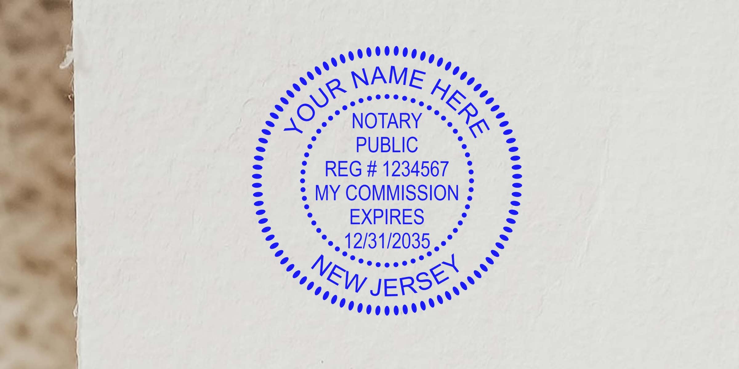 Blue circular notary public rubber stamp on white paper reading "Your Name Here, Notary Public, Reg #1234567, My Commission Expires 12/31/2035, New Jersey"
