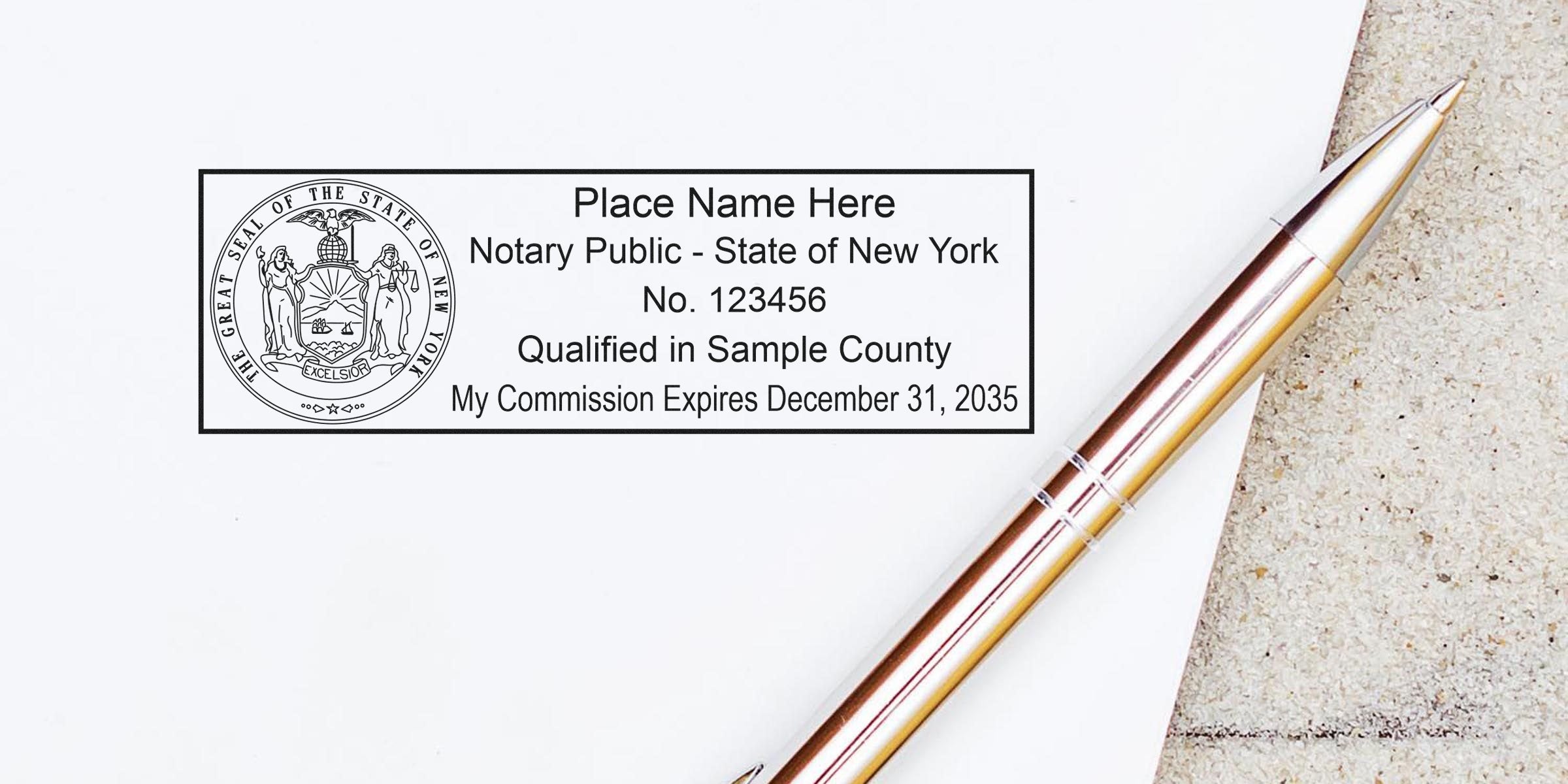 Close-up of a New York notary public rubber stamp imprint with state seal, sample commission details and a metallic pen on white paper.