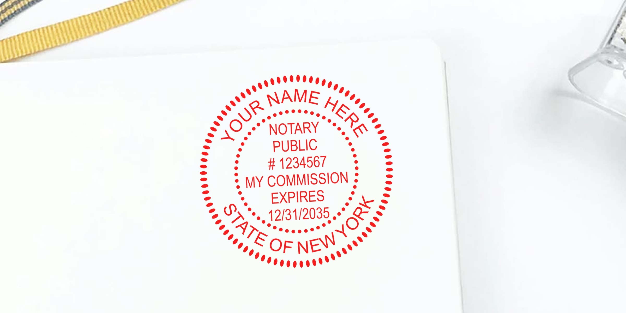 Red circular notary public stamp mockup on white background reading "Your Name Here," "Notary Public #1234567," "My Commission Expires 12/31/2035," and "State of New York."