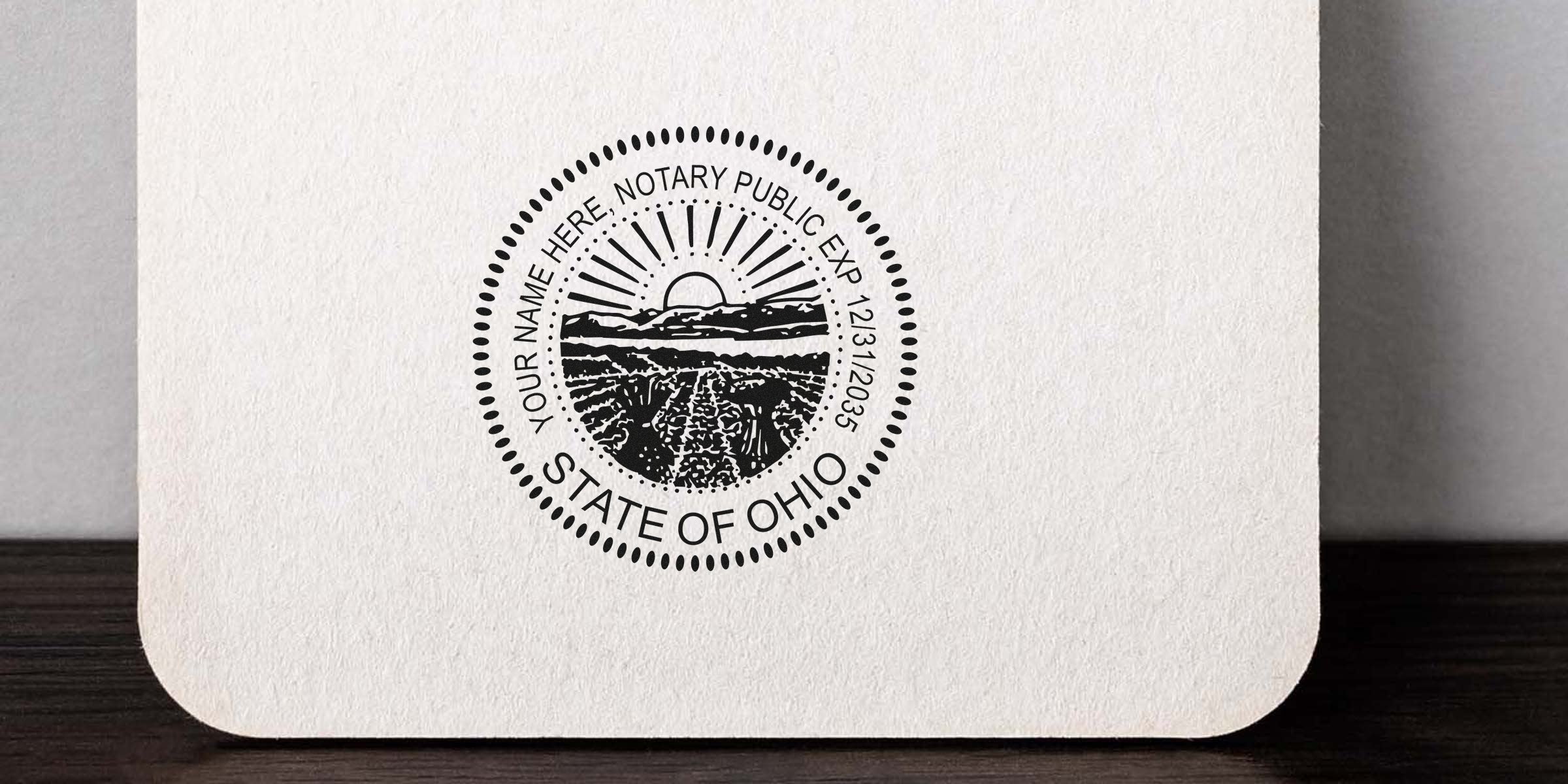Circular State of Ohio notary seal stamped on textured paper featuring sunrise over farmland, dotted border, vintage black ink design