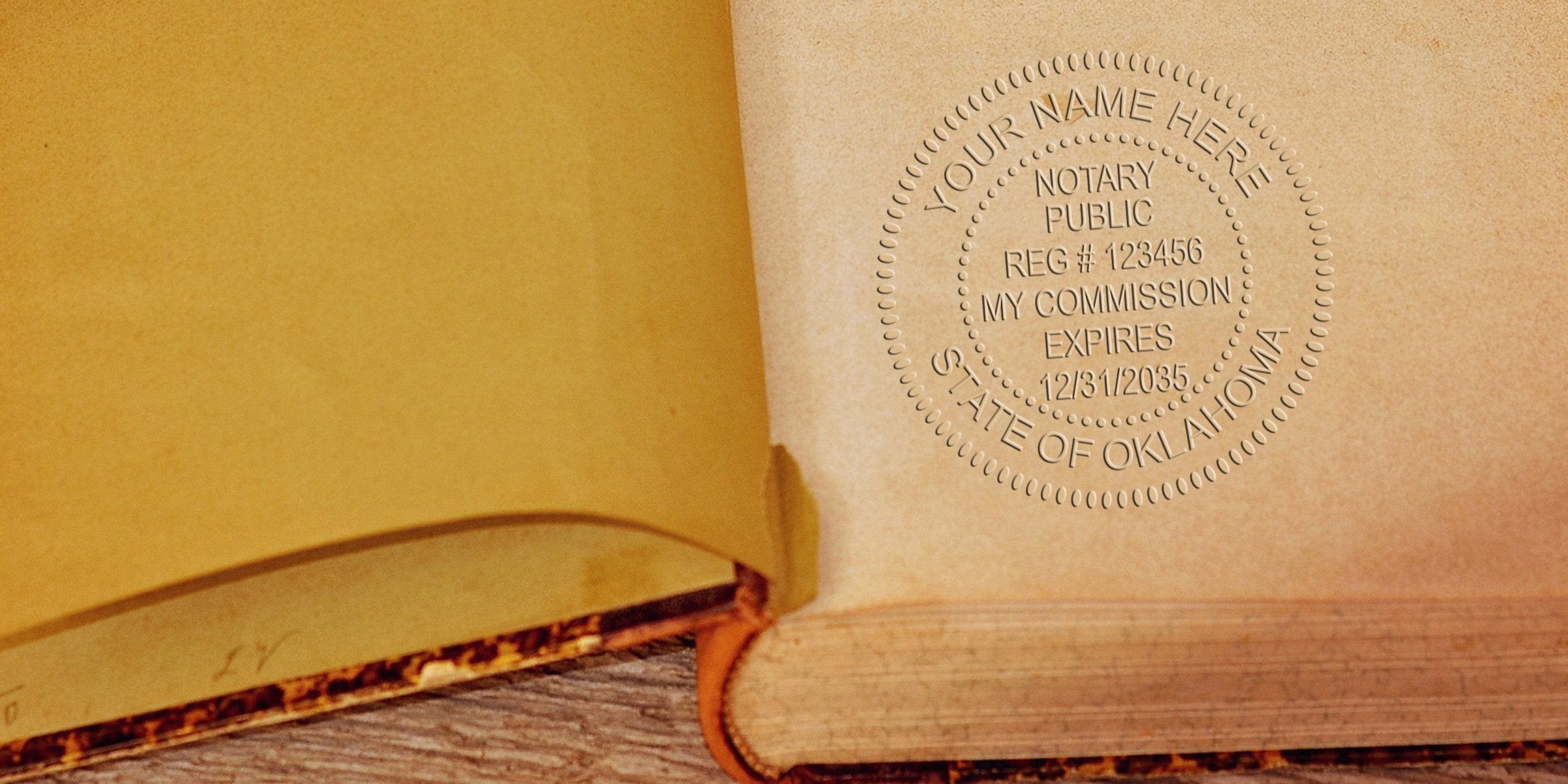 Embossed notary public seal impression on the inside cover of a vintage book, circular State of Oklahoma stamp with registration and expiration text, close-up on aged paper and binding