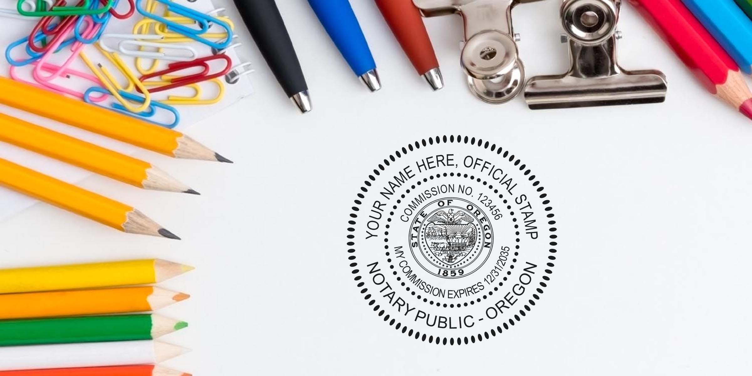 Flat lay office supplies — colored pencils, paper clips, ballpoint pens and metal binder clip beside a circular Oregon notary public stamp impression on white paper.