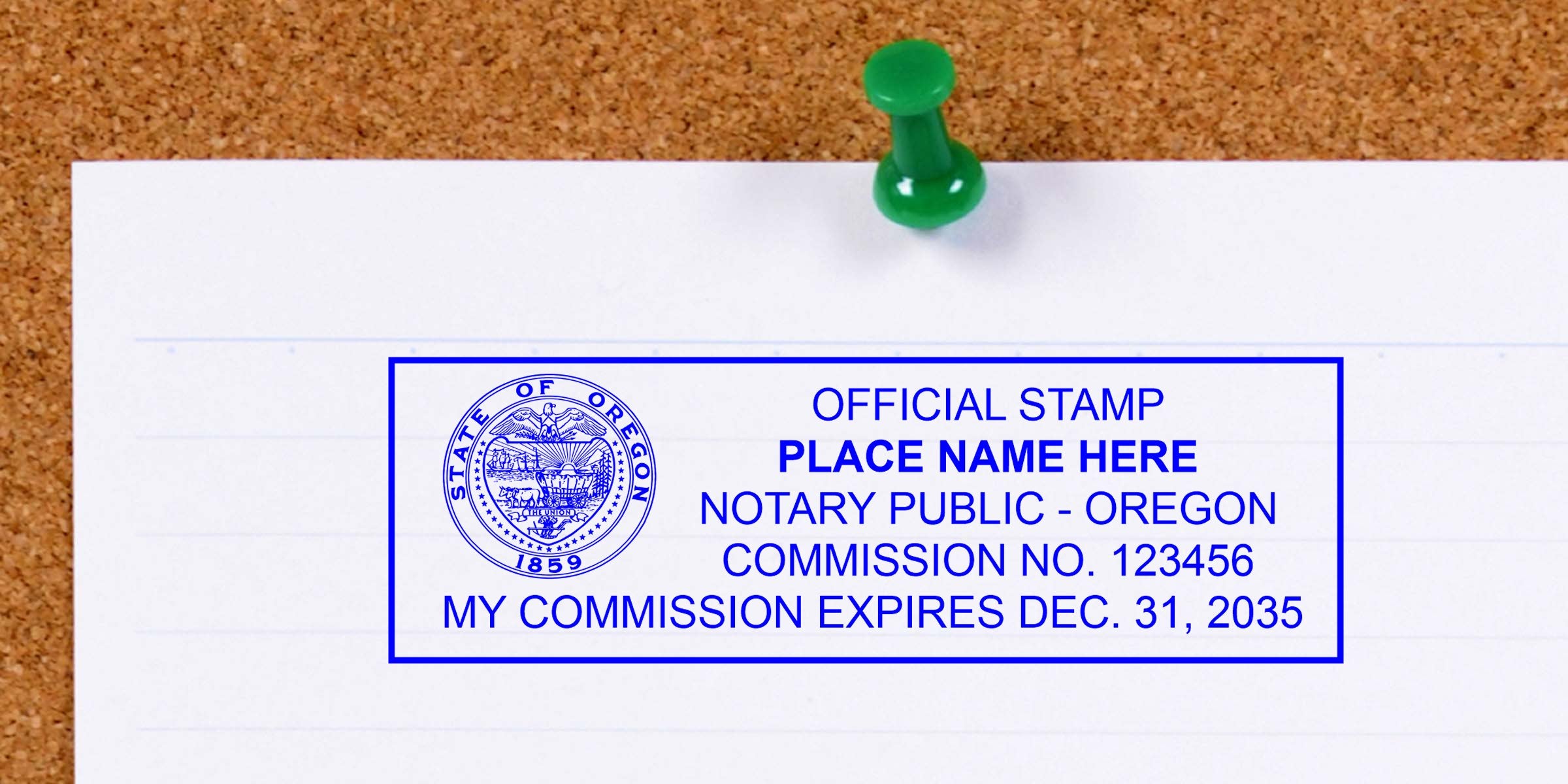 Blue Oregon notary public official stamp sample on white lined paper pinned to corkboard with a green pushpin, showing state seal, commission number and expiration date.