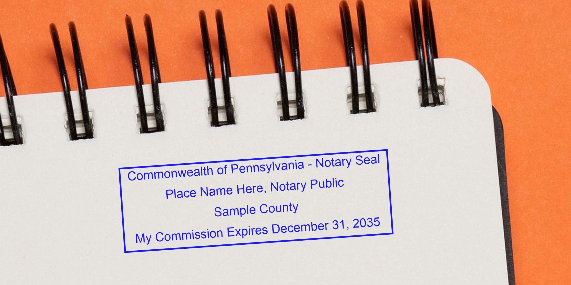 Blue rectangular Pennsylvania notary seal stamped on white spiral notebook page reading "Place Name Here, Notary Public," Sample County and "My Commission Expires December 31, 2035"