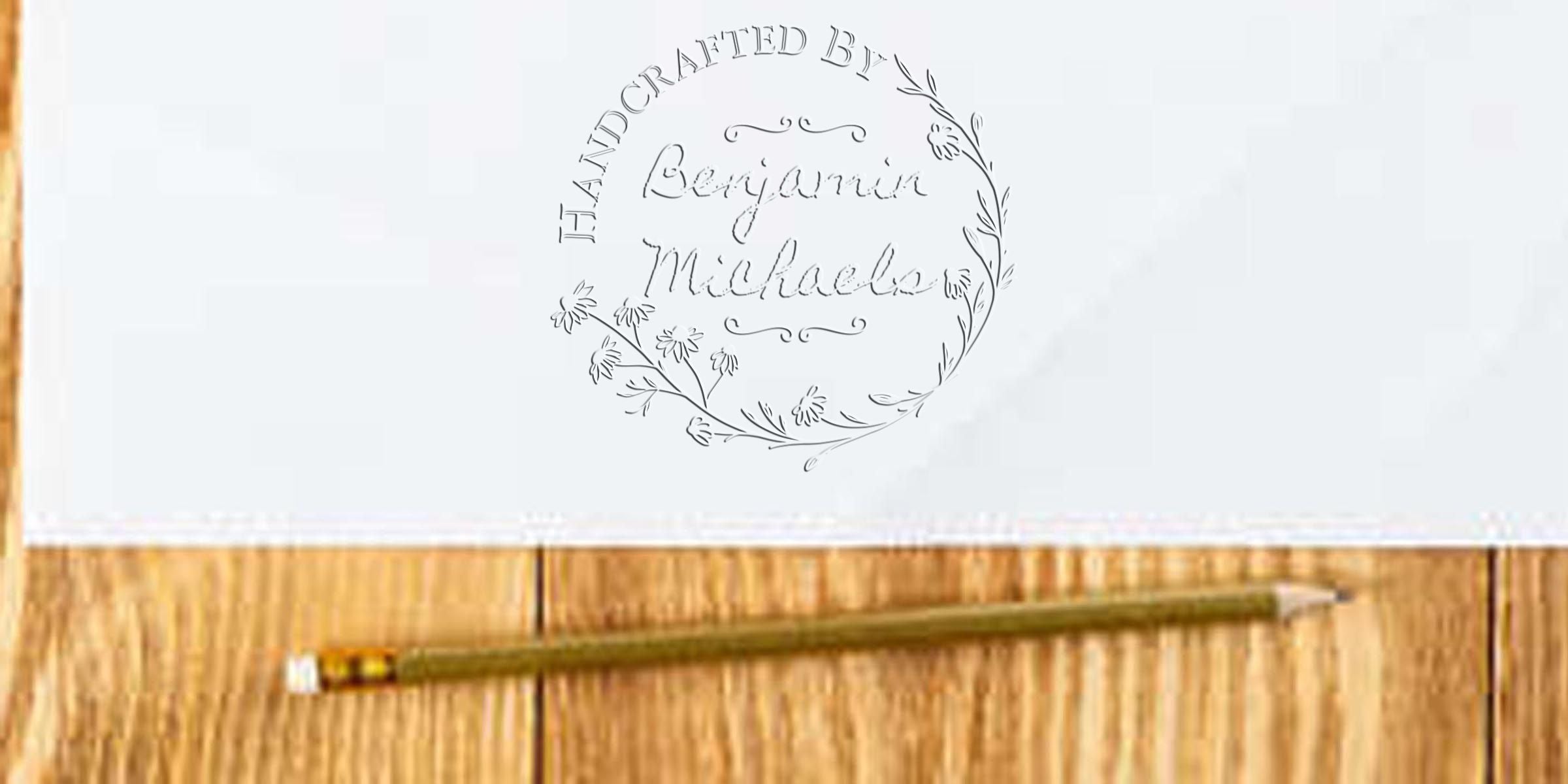 Logo reading “Handcrafted by Benjamin Michael” inside a floral circular design on a white background.