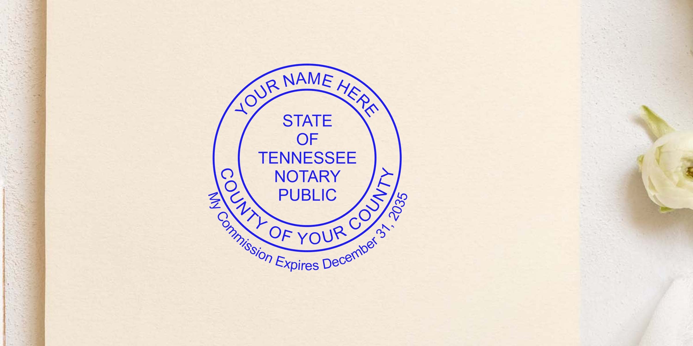 Blue circular Tennessee notary public stamp on cream paper reading “Your Name Here,” “State of Tennessee Notary Public,” county placeholder and commission expiry date.