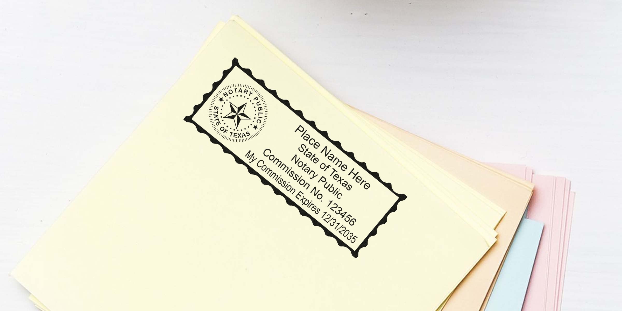 Stack of pastel file folders with a black Texas notary public stamp imprint showing commission number and expiration date on the top cream folder — office documents, notary stamp, legal paperwork, file organization.