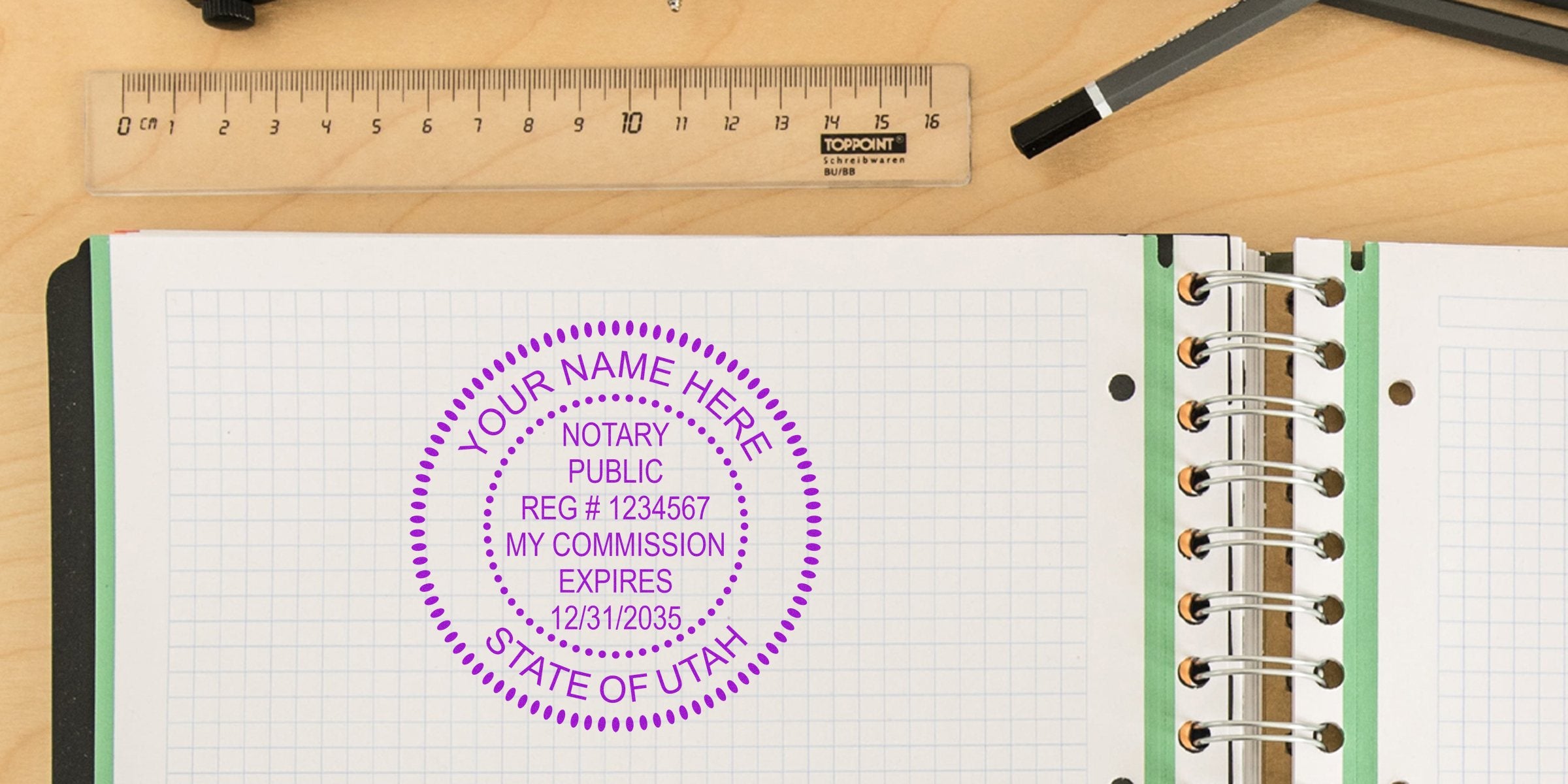 Purple circular notary public stamp on open spiral notebook with graph/grid paper, wooden desk background, clear ruler and pencil — notary stamp, commission, office supplies