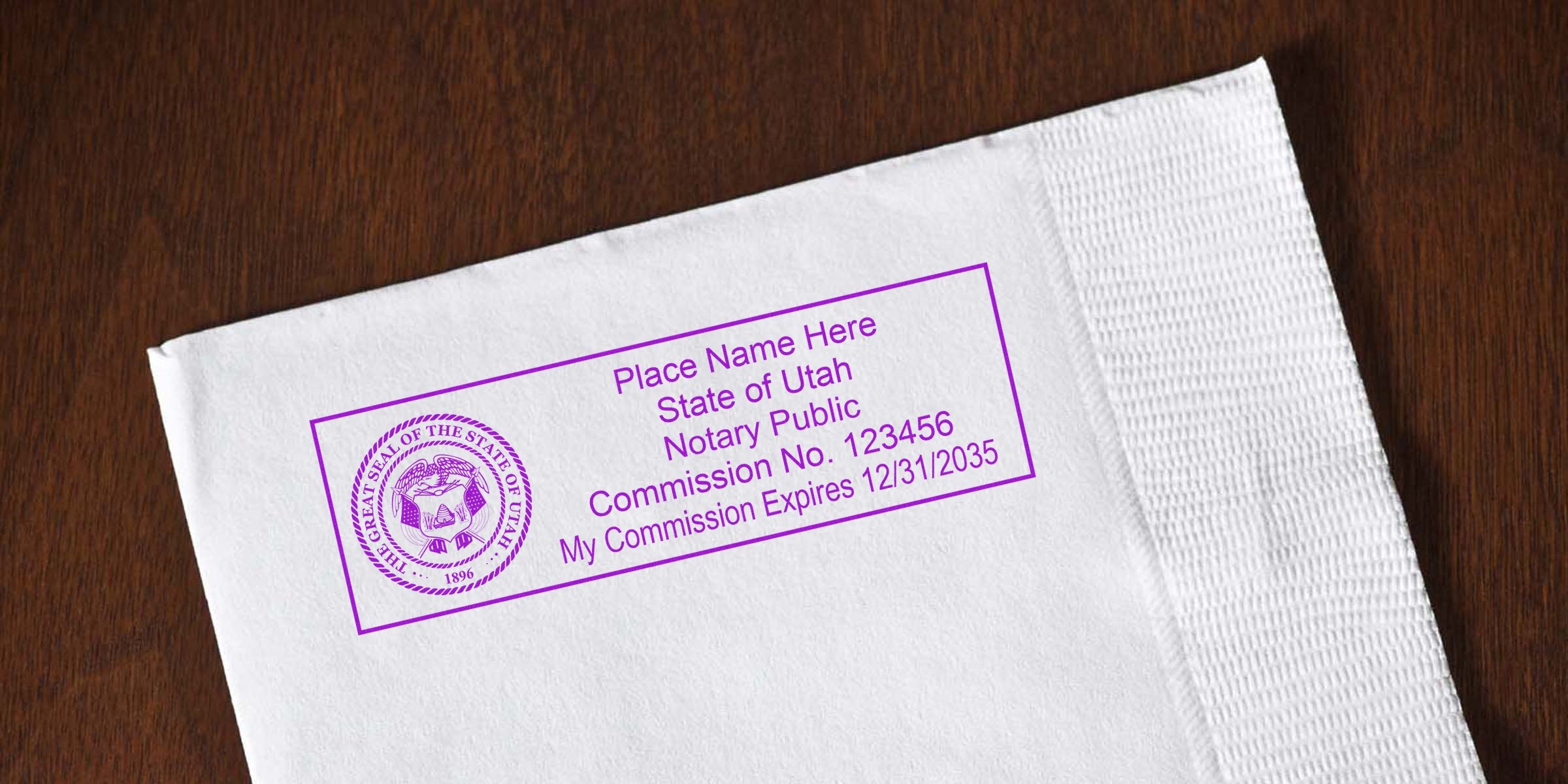 Purple Utah notary public stamp impression on white envelope with state seal and commission details, on a wooden table background