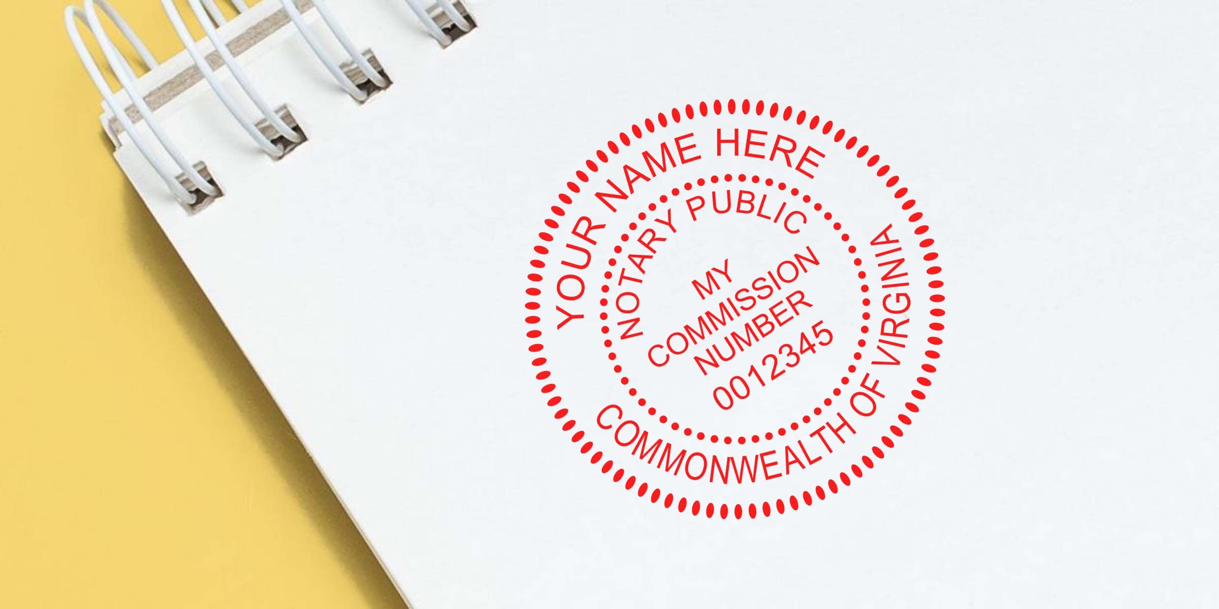 Red circular notary public stamp reading "Your Name Here, Commonwealth of Virginia, My Commission Number 0012345" printed on a white spiral-bound notebook page over a yellow background