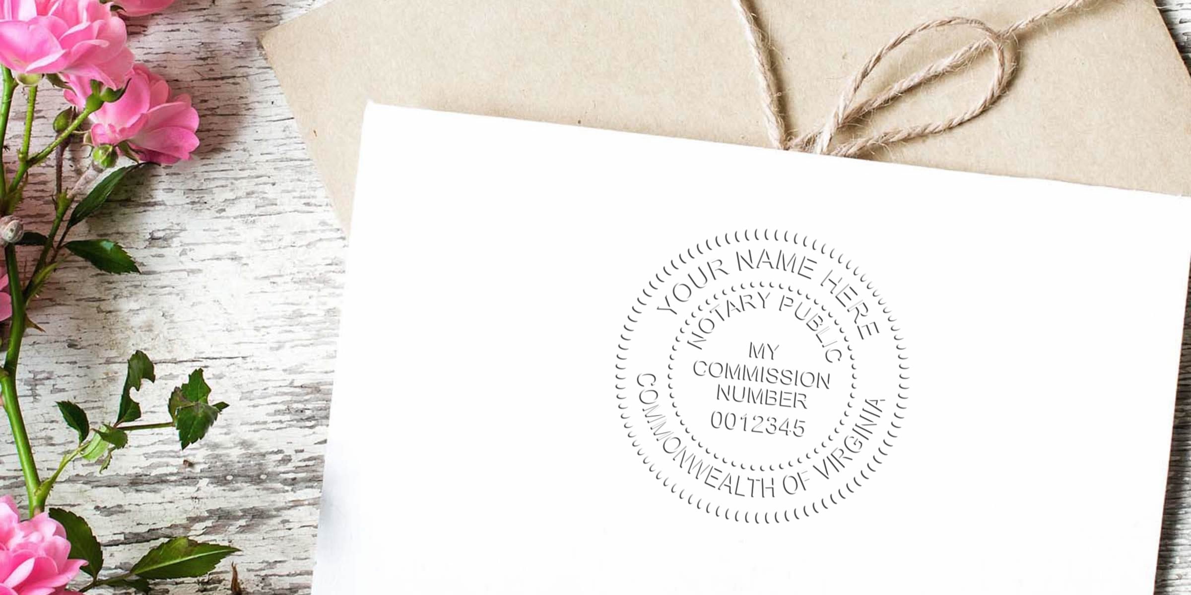 White envelope with embossed notary seal stamped "Commonwealth of Virginia," kraft twine-wrapped envelope, pink roses and rustic whitewashed wood background — stationery, wedding or legal mail image