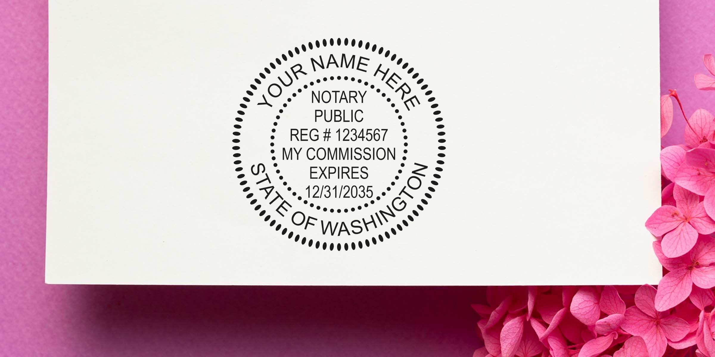Black circular notary public stamp mockup reading "Your Name Here, Notary Public, Reg #1234567, My Commission Expires 12/31/2035, State of Washington" on white card with pink flowers.