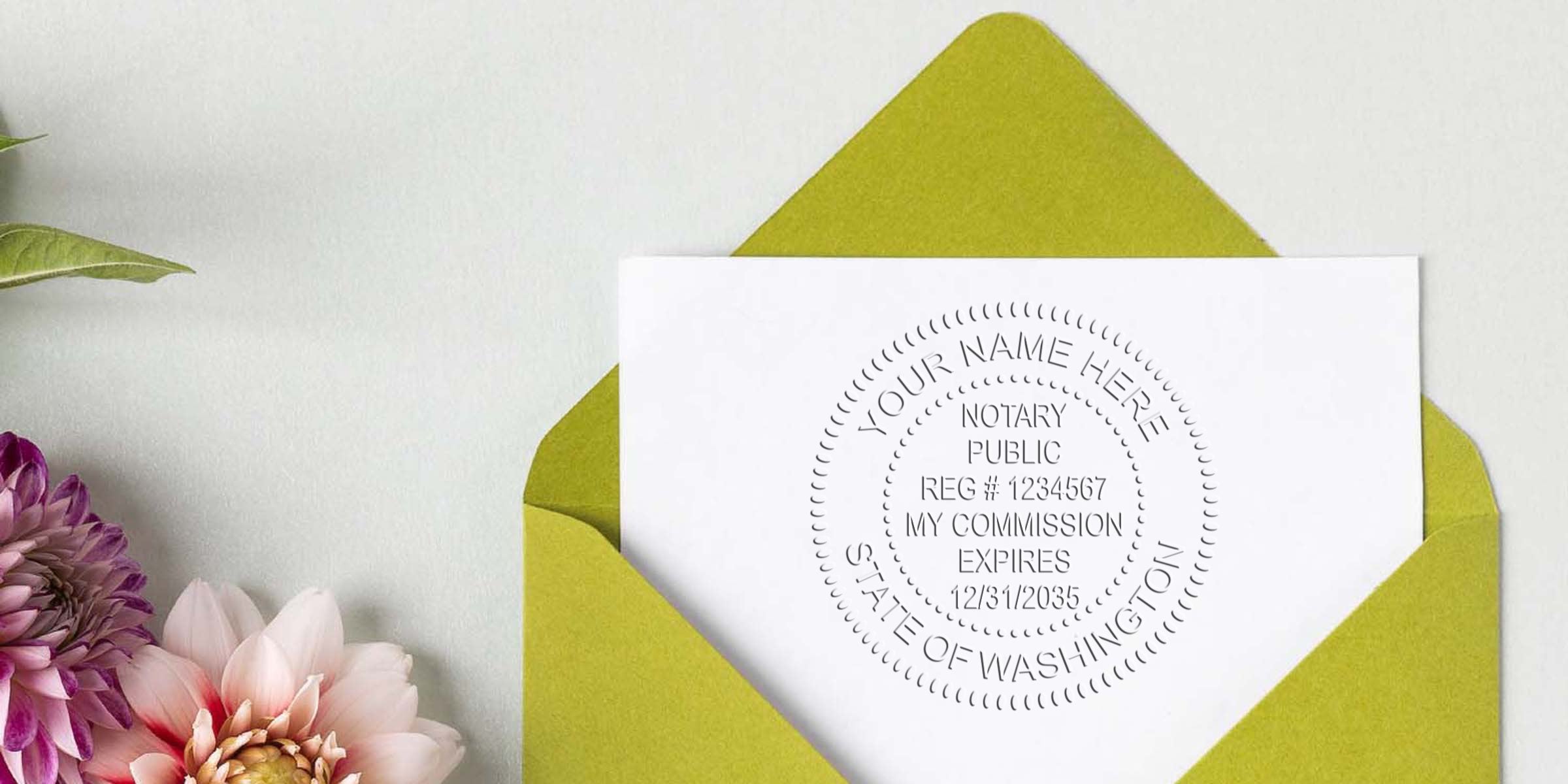White card with circular notary public embossing stamp (State of Washington) inside a green envelope, flat-lay styled with pink and purple dahlia flowers on a light gray background — professional notary stationery mockup