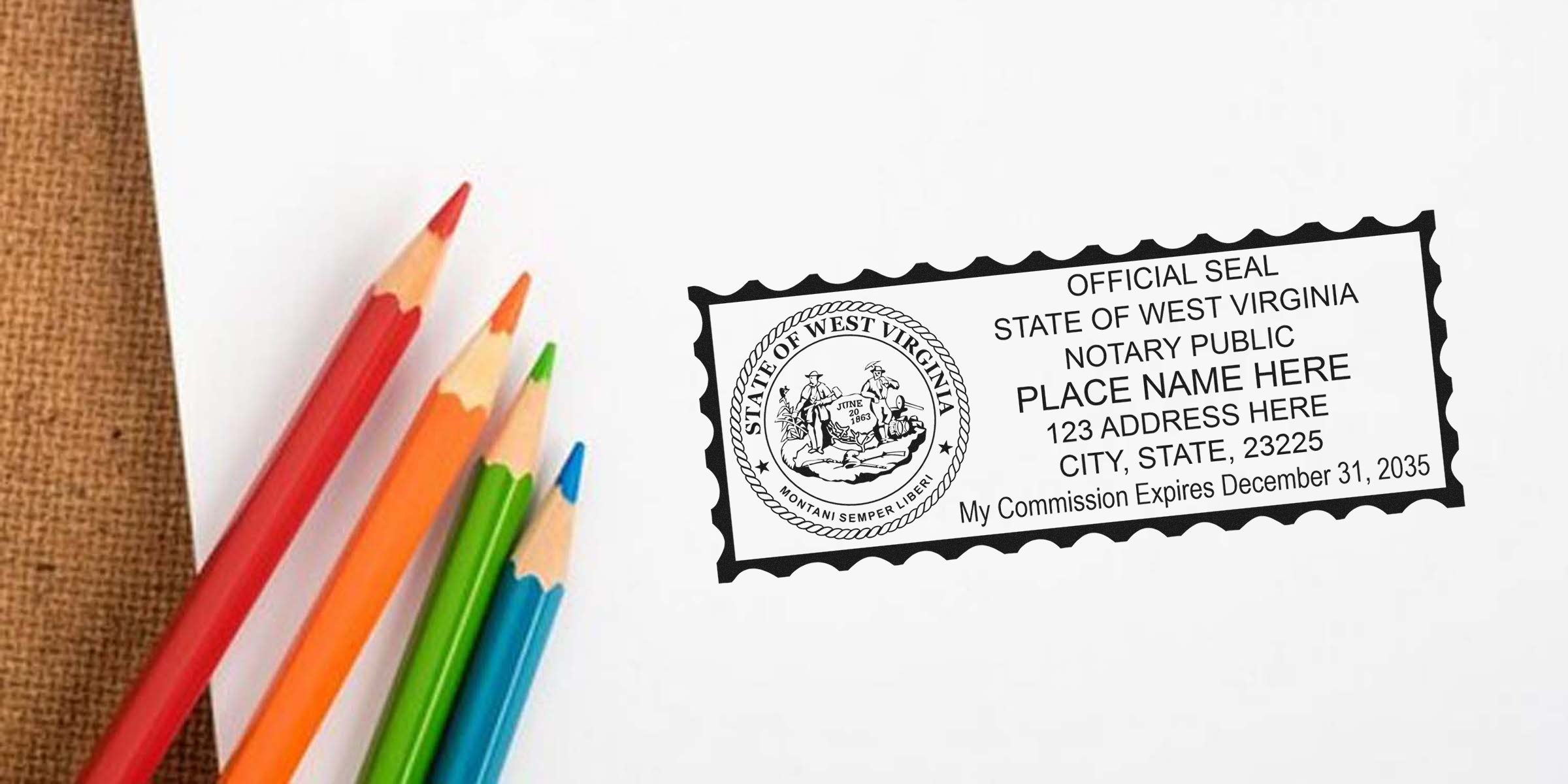 Top-down photo of colorful colored pencils next to a sample West Virginia notary public stamp with official state seal, placeholder name and address, and commission expiration date on white paper
