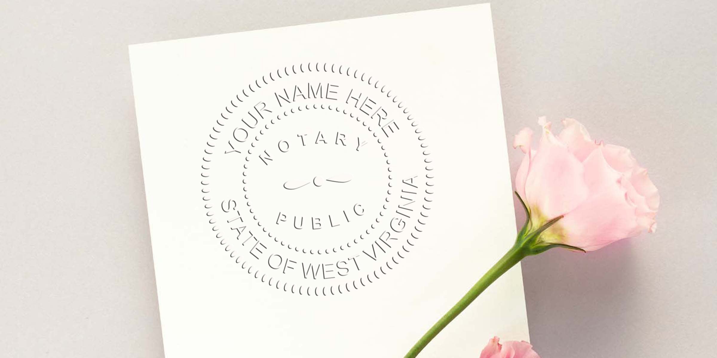 White embossed notary public seal mockup reading "Your Name Here, Notary Public, State of West Virginia" on an angled white card with a soft pink rose on a pale background — elegant business stationery branding photo