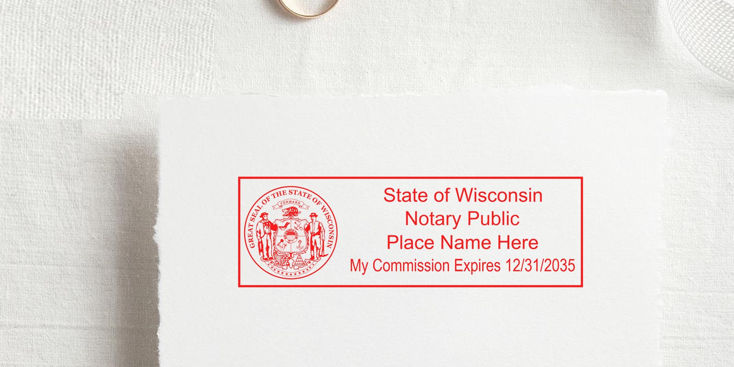 Red rectangular State of Wisconsin Notary Public stamp with state seal, placeholder "Place Name Here" text and "My Commission Expires 12/31/2035" printed in red on white textured paper