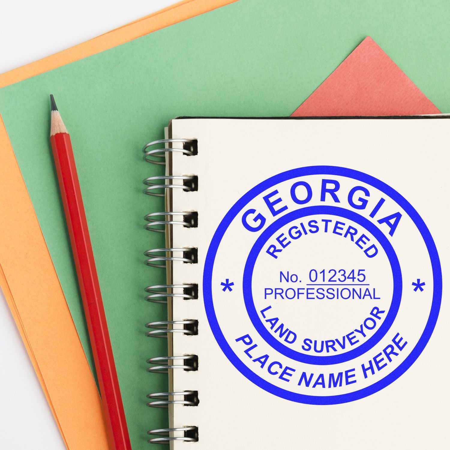 Sealing the Deal: Best Georgia Land Surveyor Stamp Designs Feature Image showing a surveyor stamp on a notebook with a red pencil.