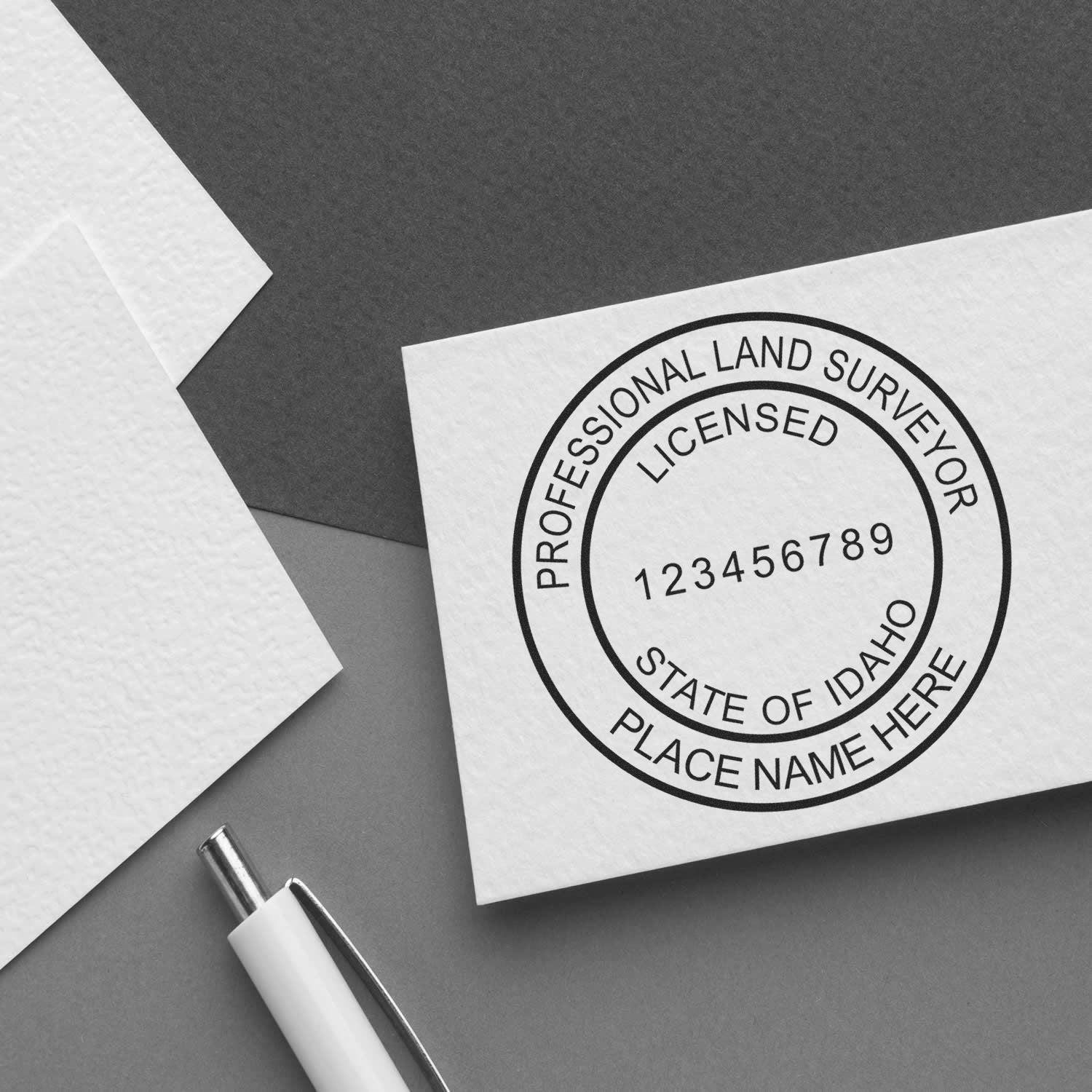 Image of a professional land surveyor seal on a business card. Blog post: Idaho Land Surveyor Seal Requirements: Your Key to Success Feature Image.