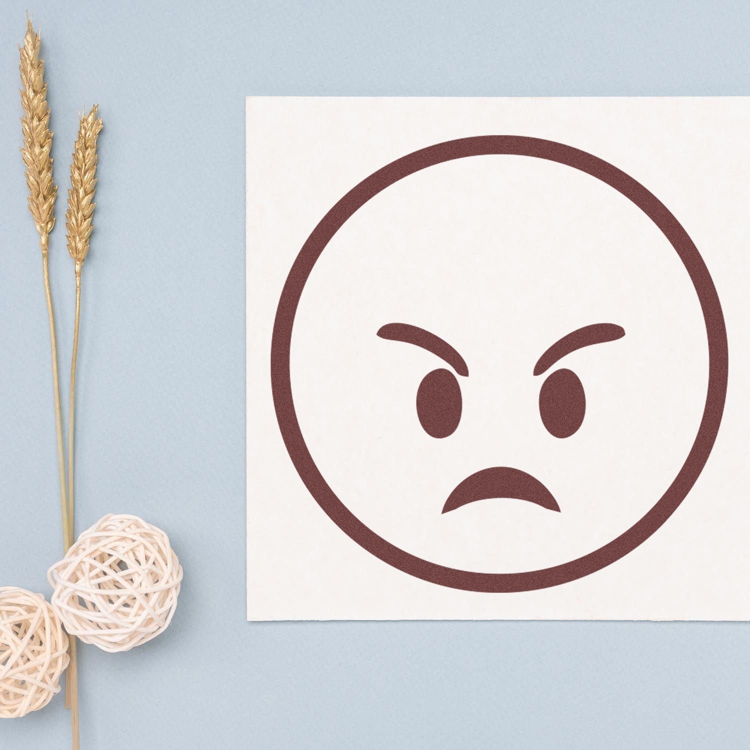 Wood Handle Furious Fred Emoji Rubber Stamp on light blue background, featuring an angry face design. Perfect for crafting and personalizing projects with a touch of humor and expression.