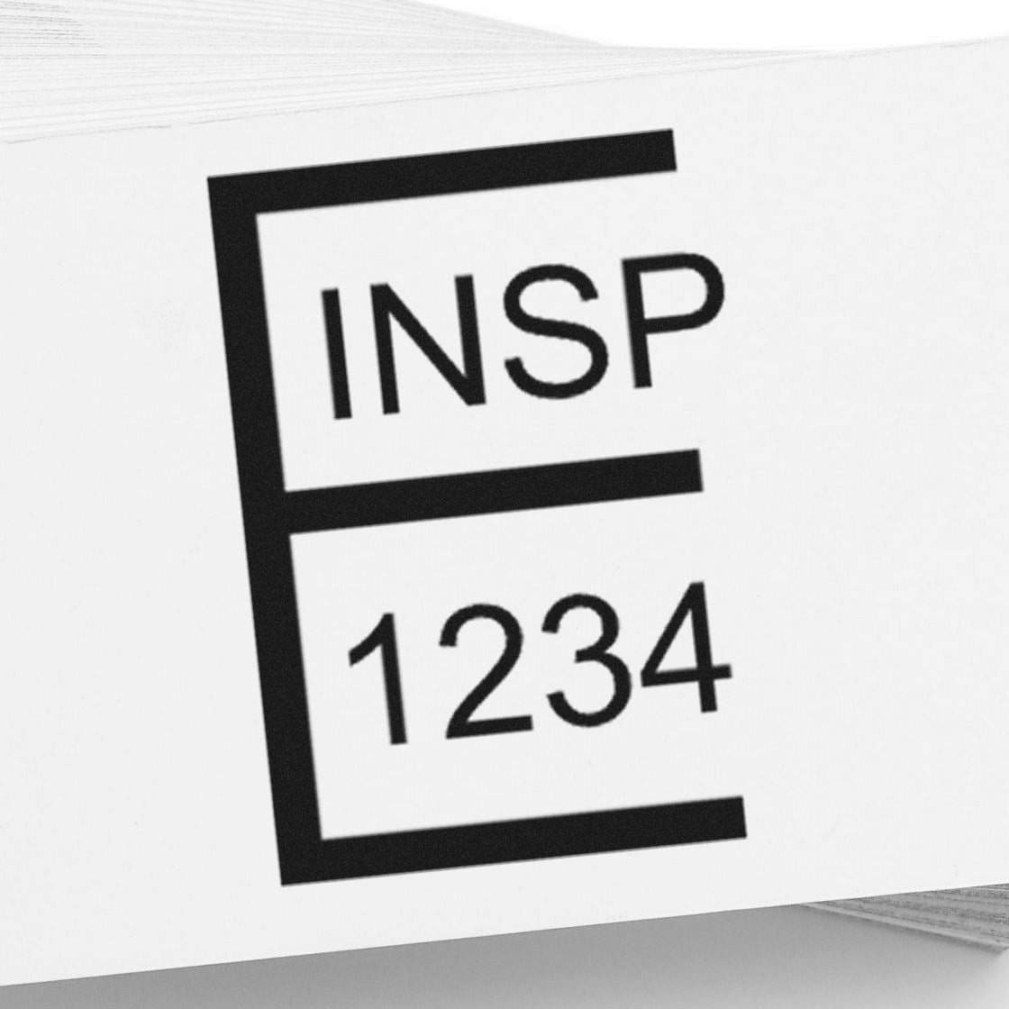 Black INSP 1234 stamp seal design on white background