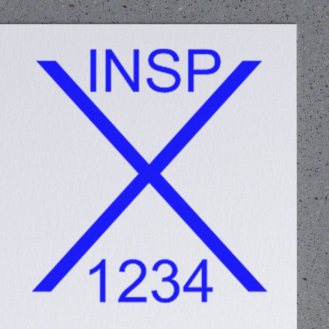 Blue INSP seal stamp with a large X and 1234 in blue on white paper against a gray textured background.