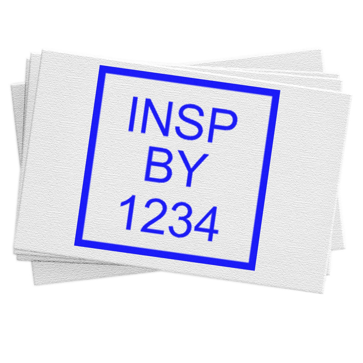 Blue INSP BY 1234 inspection stamp seal on stacked white textured sheets