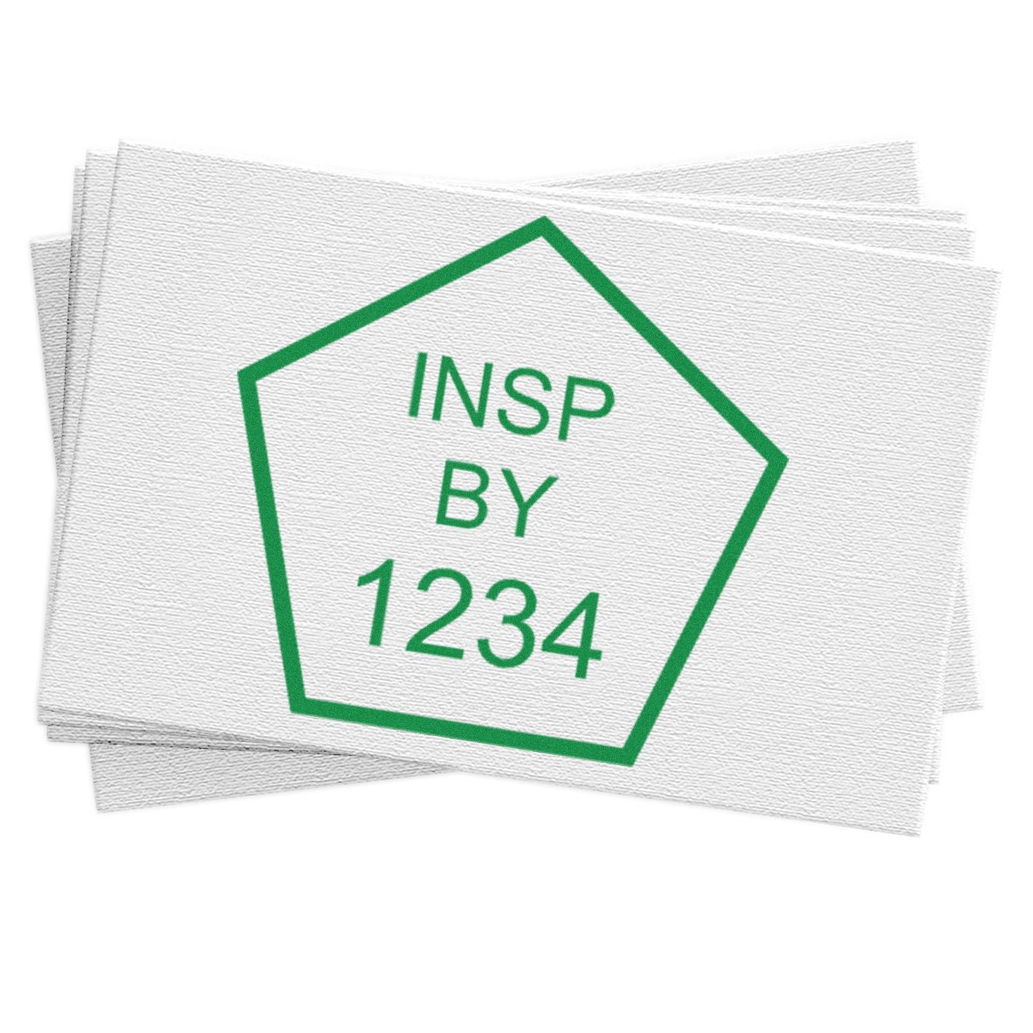 Green pentagon inspection stamp seal reading INSP BY 1234 on stacked white textured samples.