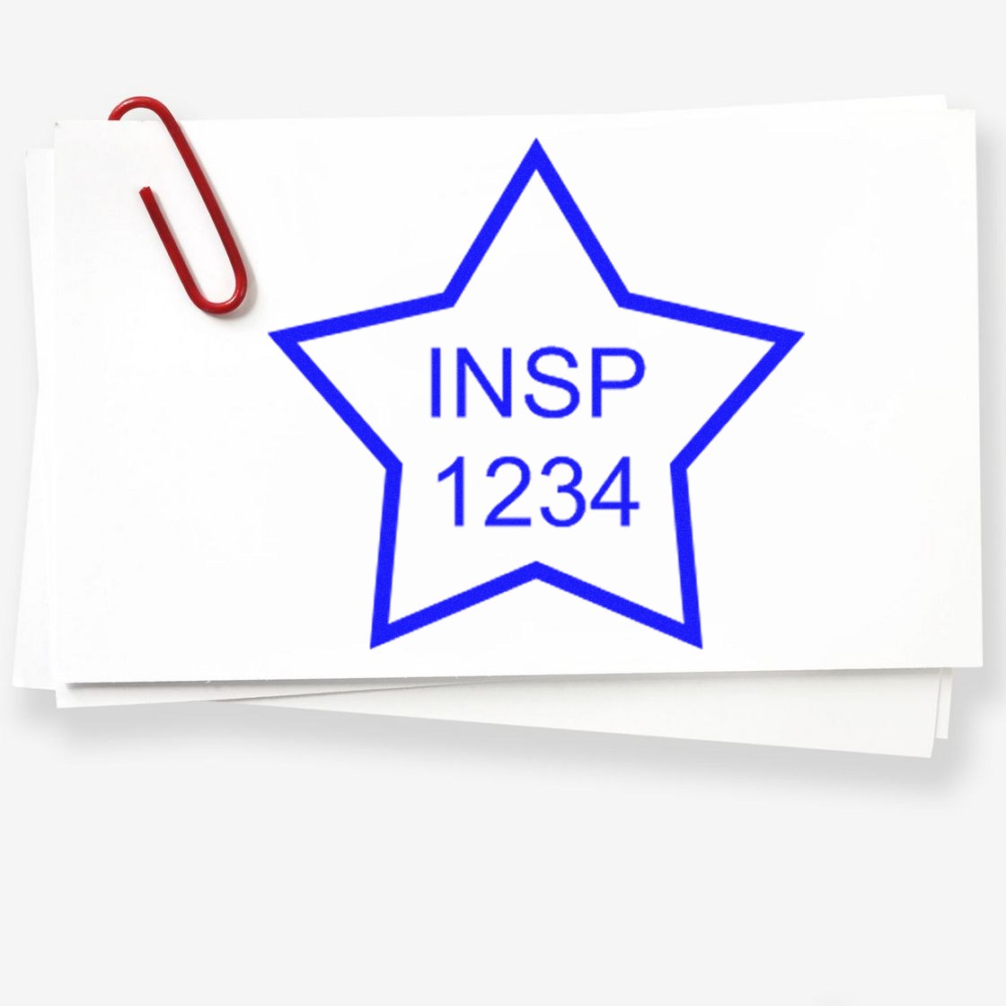 White cards with a red paperclip and a blue star-shaped inspection stamp reading INSP 1234.