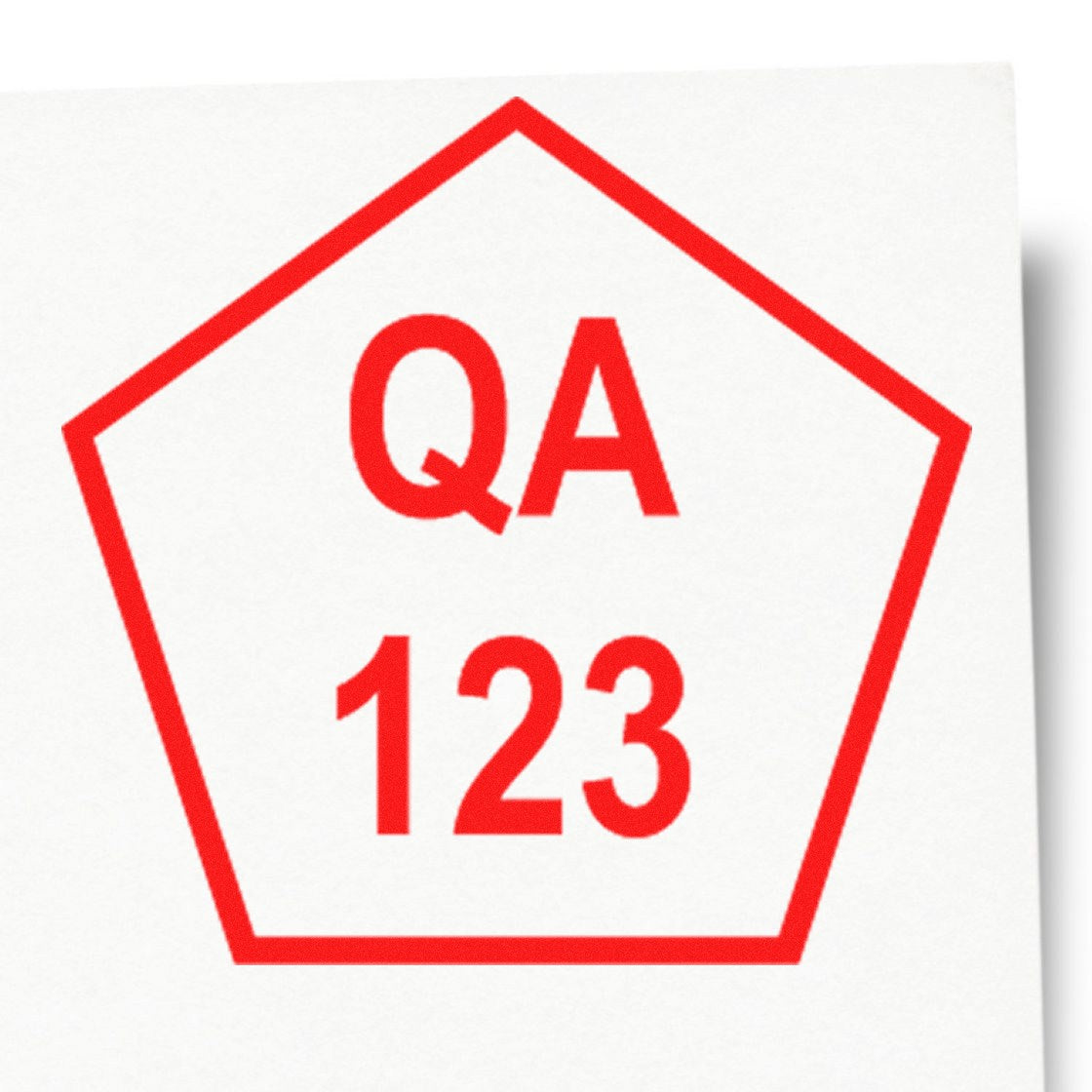 Red pentagon QA 123 quality assurance stamp seal on white background