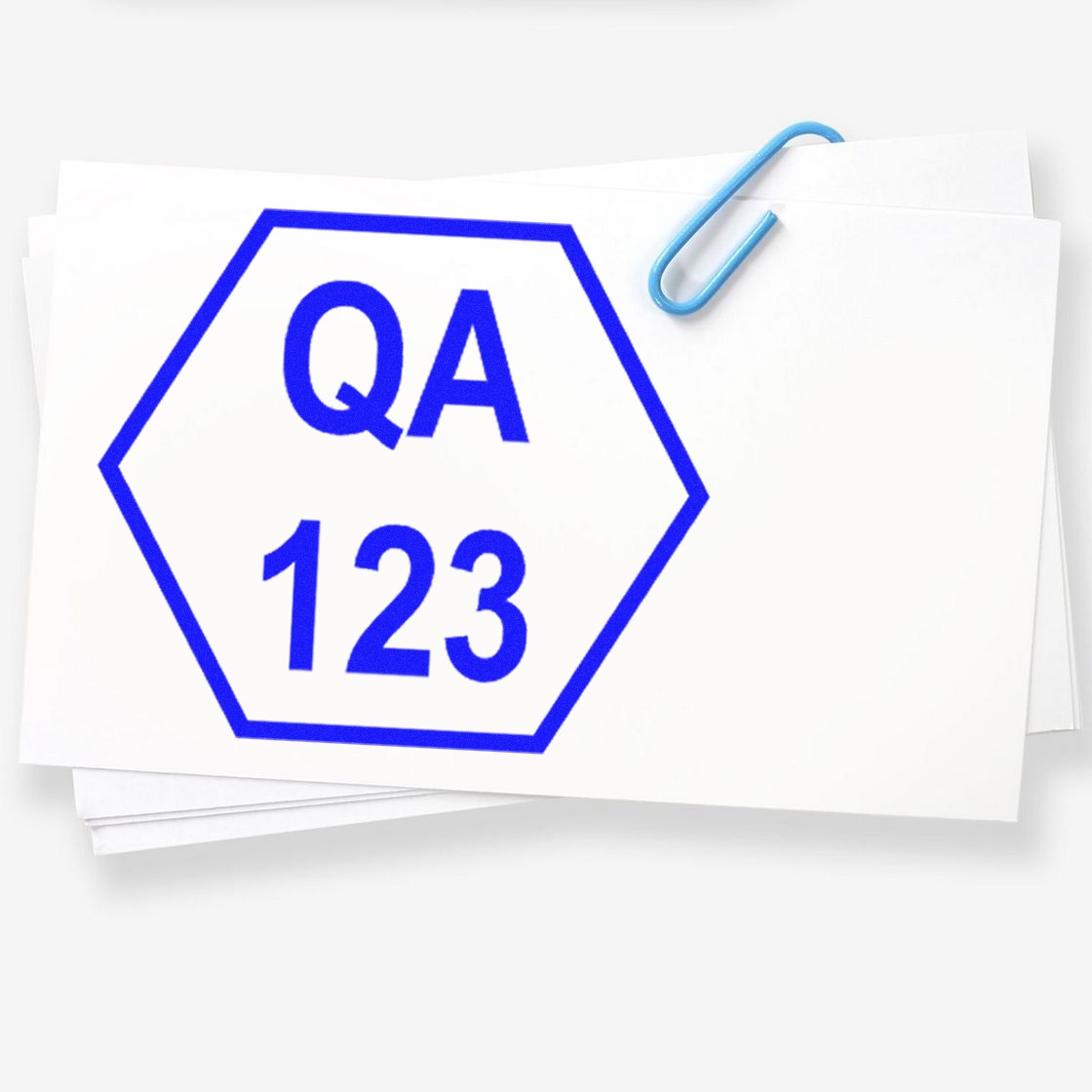 Blue QA 123 hexagon stamp seal on stacked white papers with a light blue paperclip