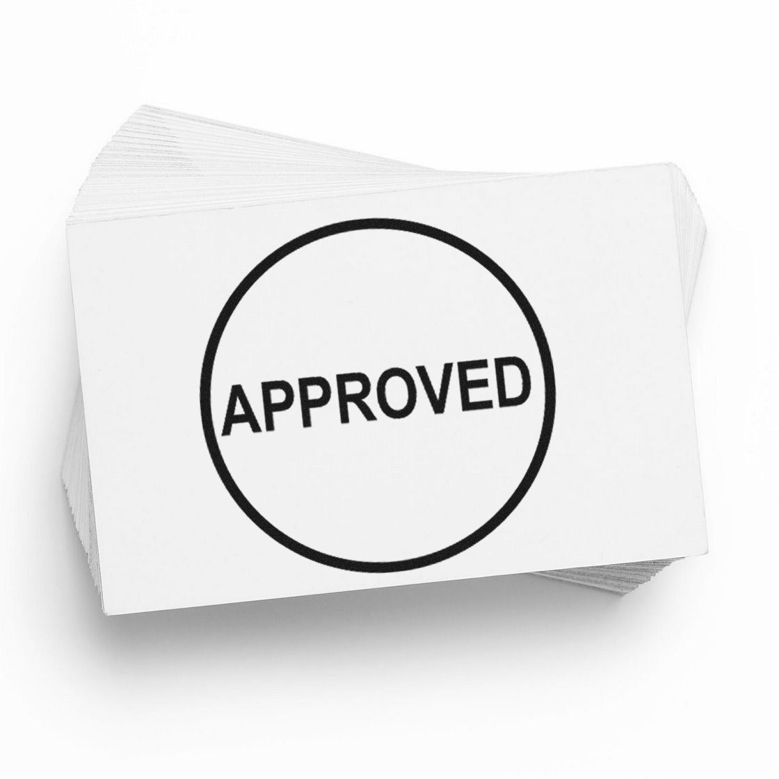 Stack of white stamp and seal cards with a bold black circular APPROVED seal on top