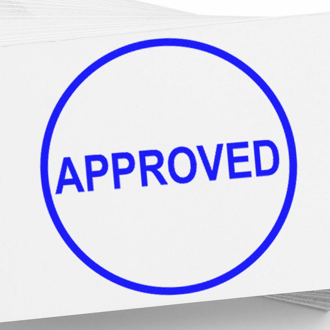 Blue circular APPROVED rubber stamp seal on white paper, bold uppercase text.