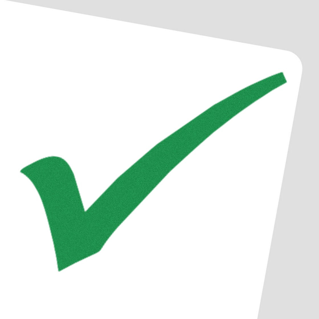 Green checkmark rubber stamp seal on a white card background, angled slightly, in bright green.