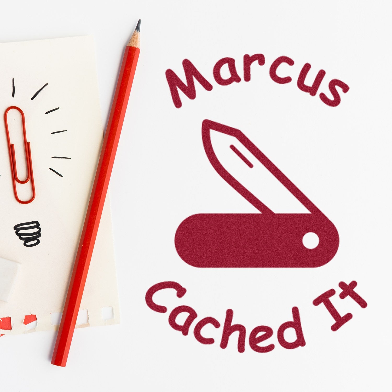 Maroon Marcus Cached It stamp and seal logo with a red pencil, paperclip, and sketch notes on white paper.
