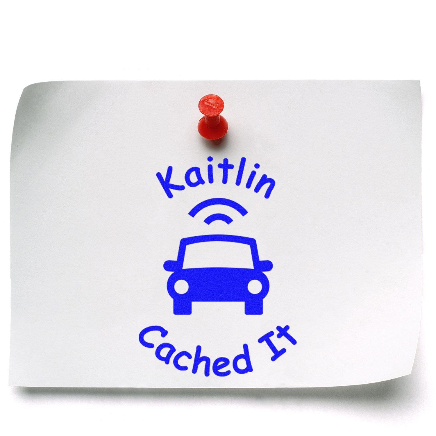 Blue custom stamp seal reading Kaitlin Cached It with car and Wi?Fi icon, pinned on white paper with a red pushpin.