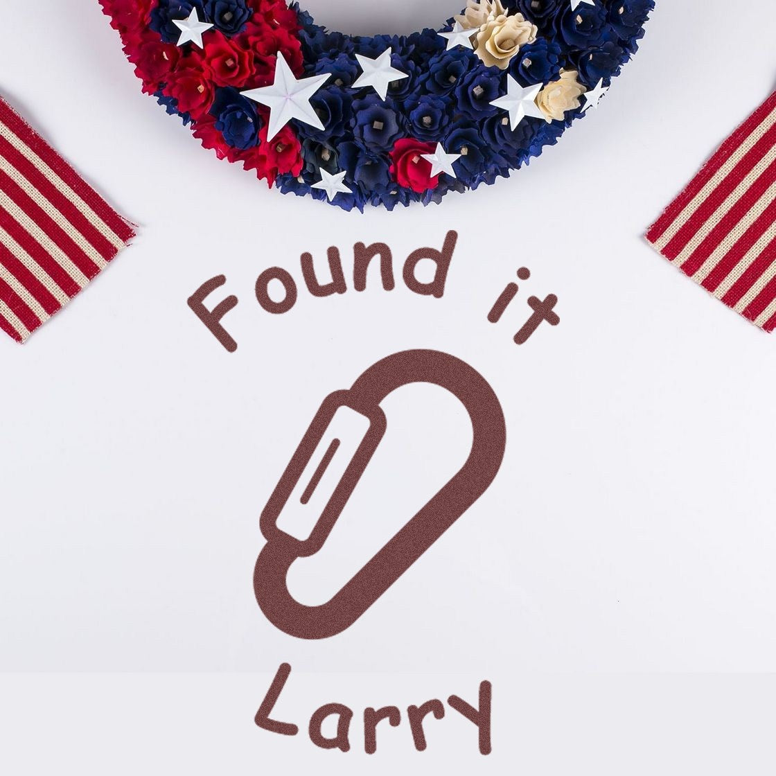 Found it Larry stamp and seal with brown paperclip icon, red, navy, and cream patriotic wreath with stars.