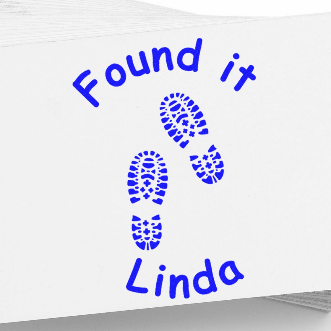 Blue custom stamp and seal reading Found it Linda with footprint icons on white paper.