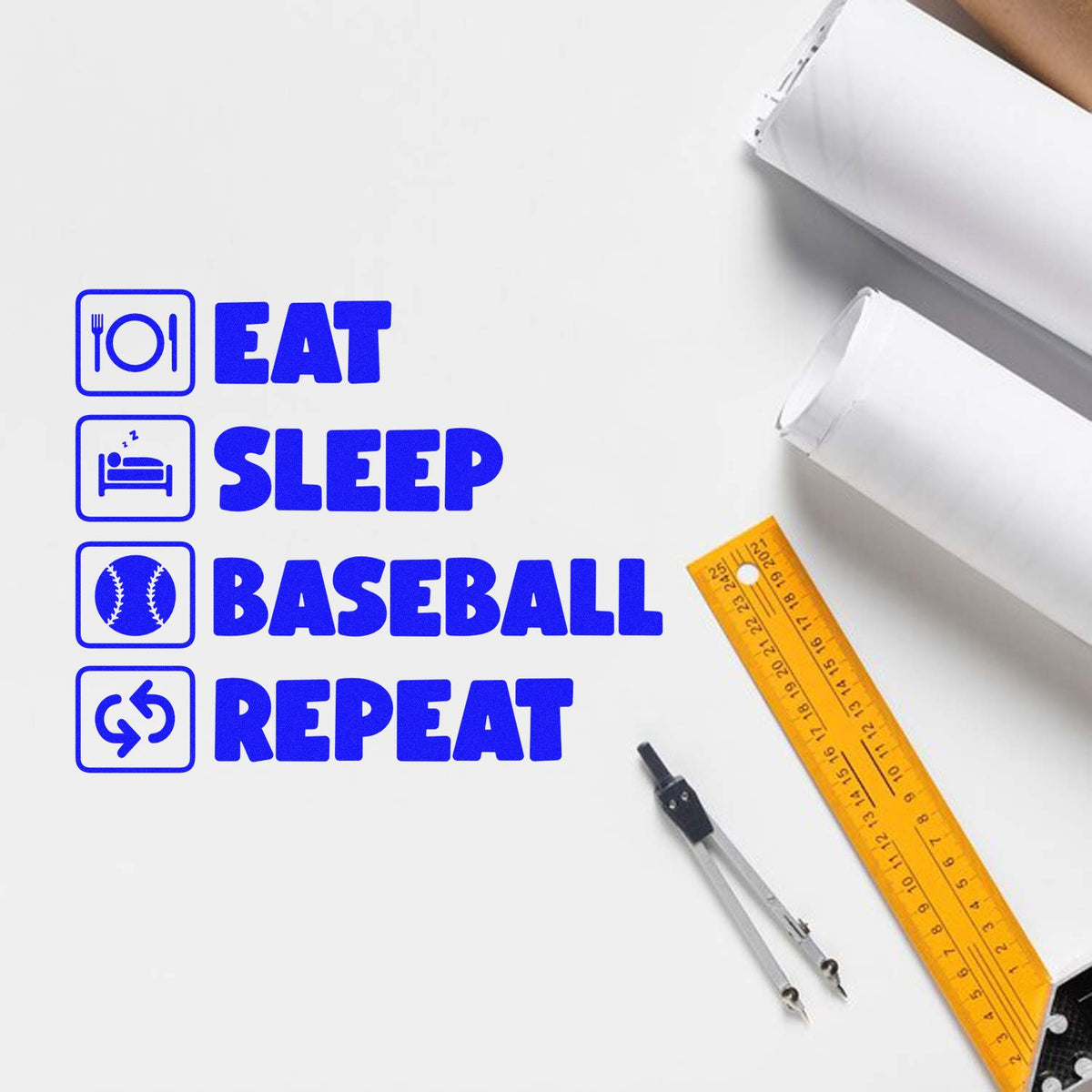 Blue stamp seals reading EAT SLEEP BASEBALL REPEAT with icons, on white paper beside a yellow ruler and compass.