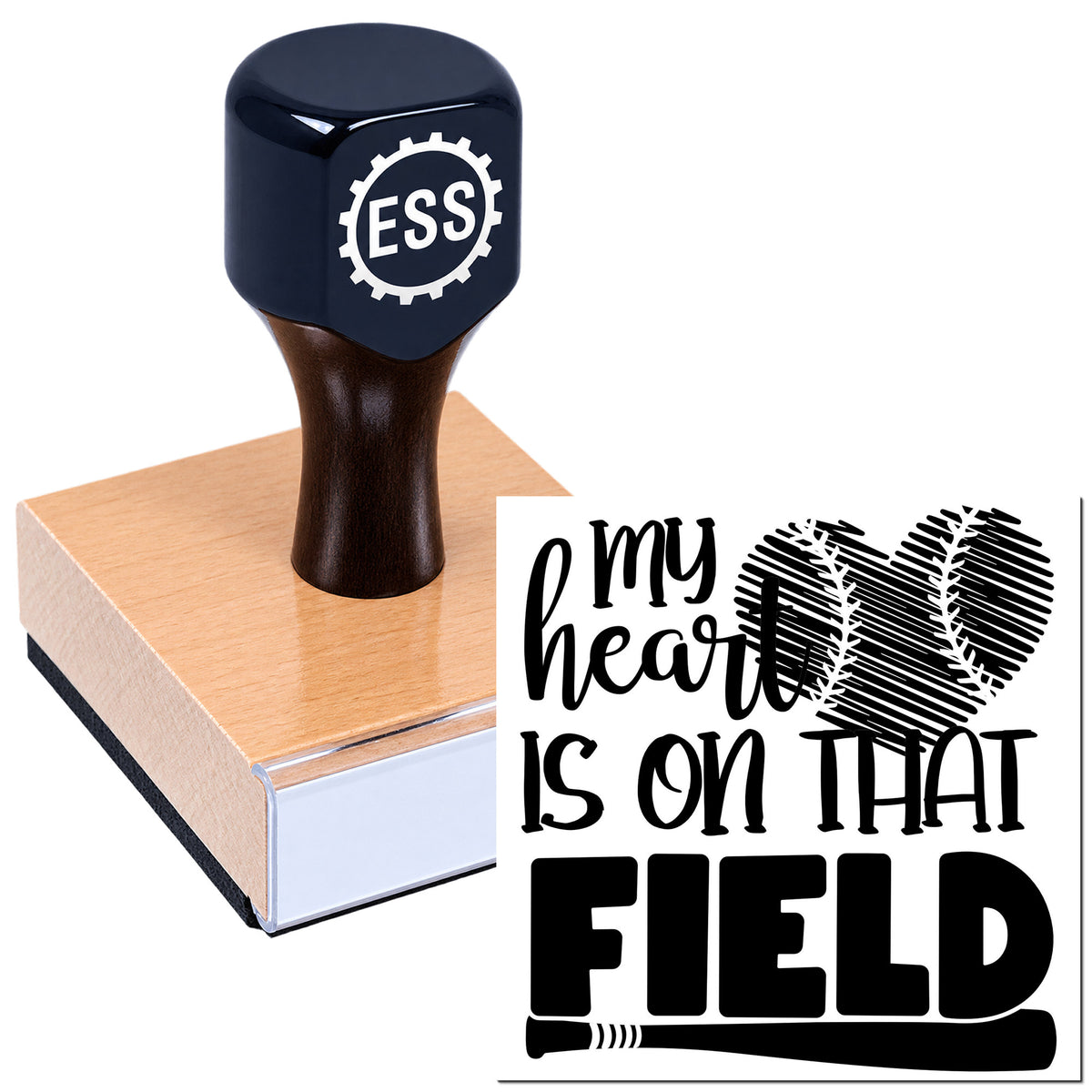 Custom rubber stamp with navy handle and wooden base, featuring "my heart is on that field" baseball heart design.