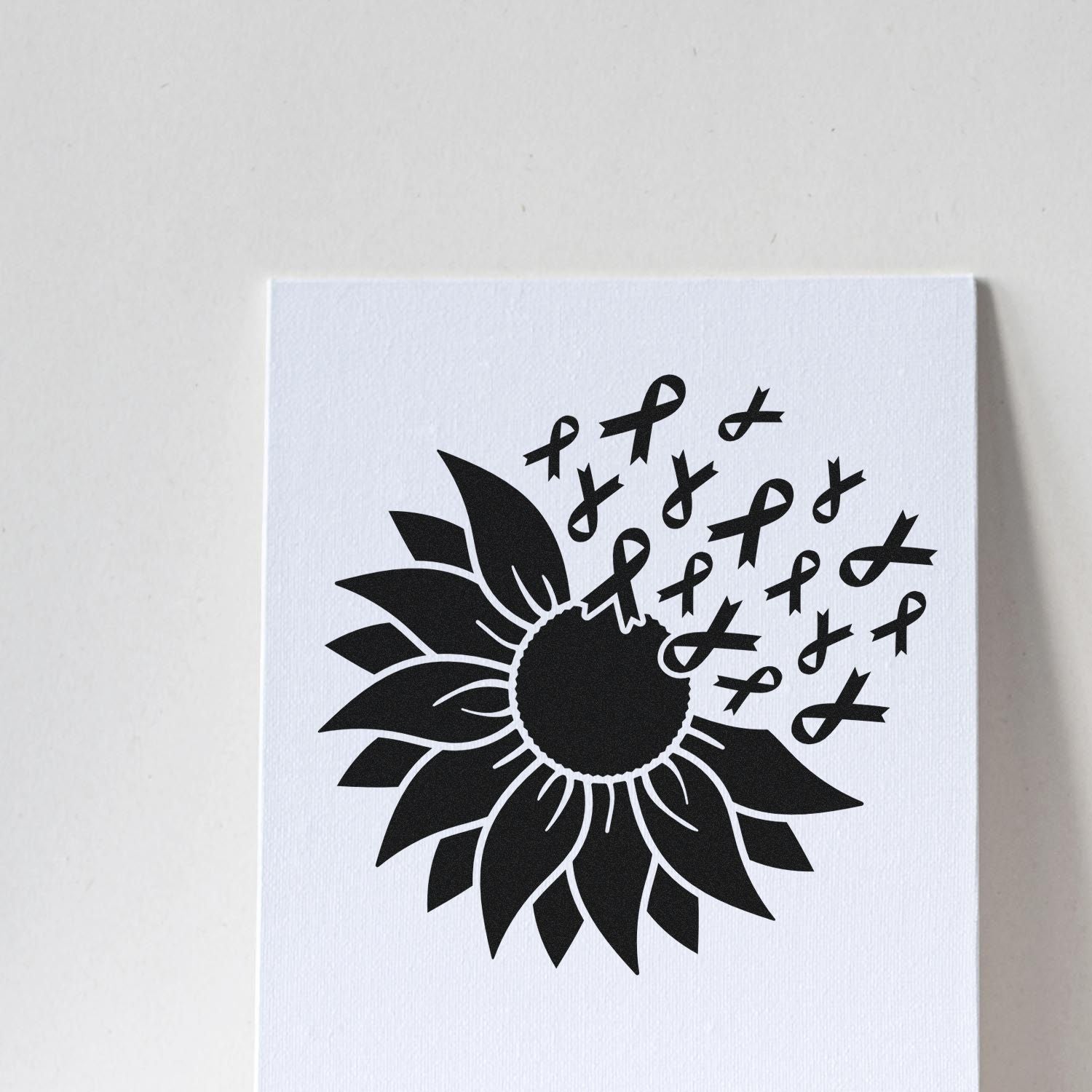 Black sunflower stamp seal with multiple black awareness ribbons on a white background.