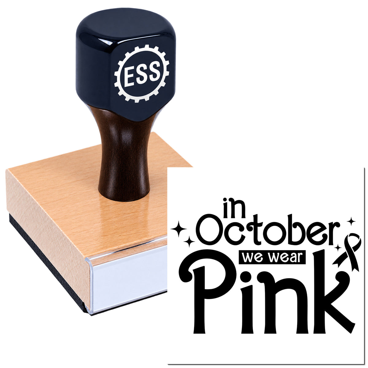 Dark blue ESS rubber stamp seal on pink wood block with "In October We Wear Pink" text and ribbon graphic.