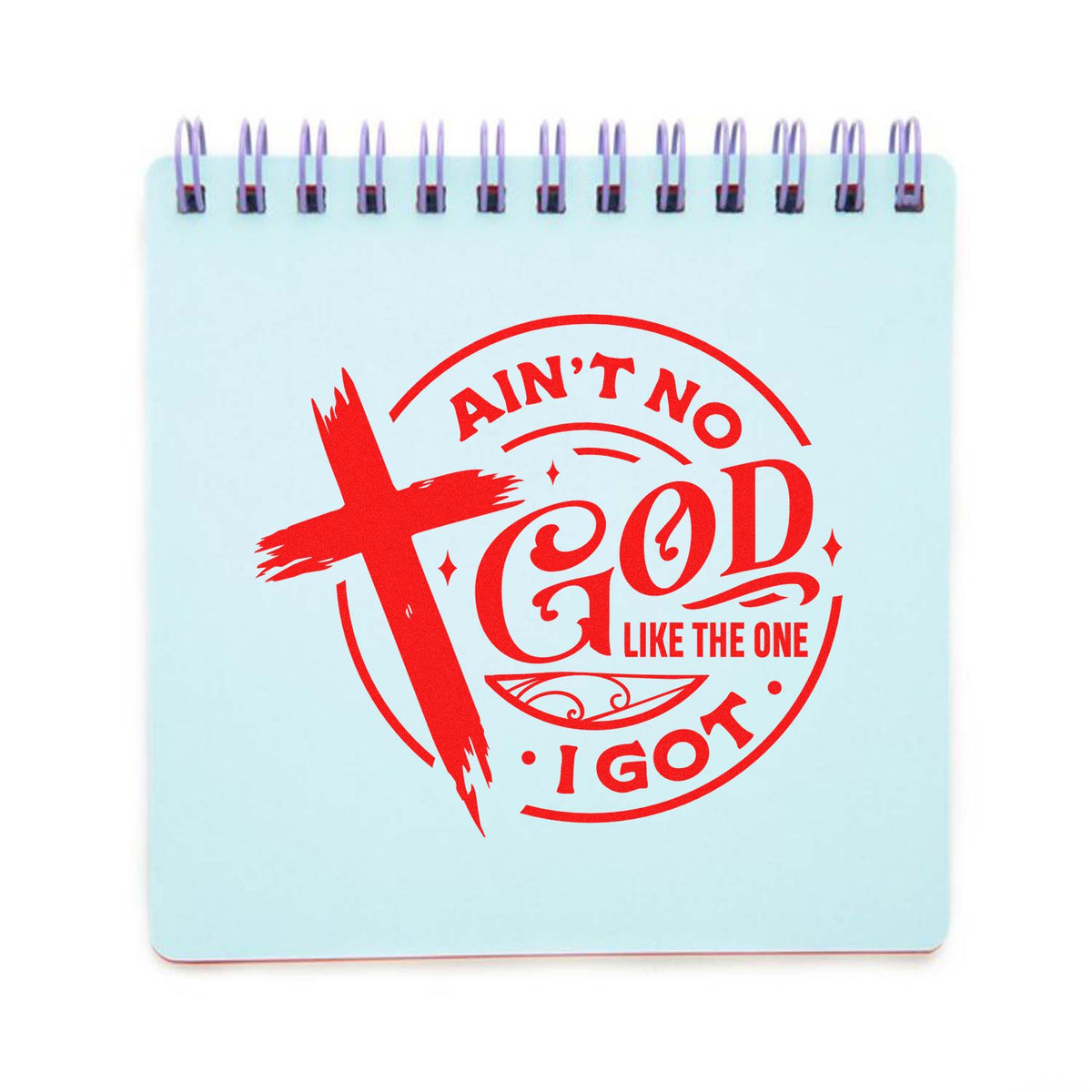Light blue spiral notebook showing a red stamp seal design with cross and text, Aint No God Like the One I Got.