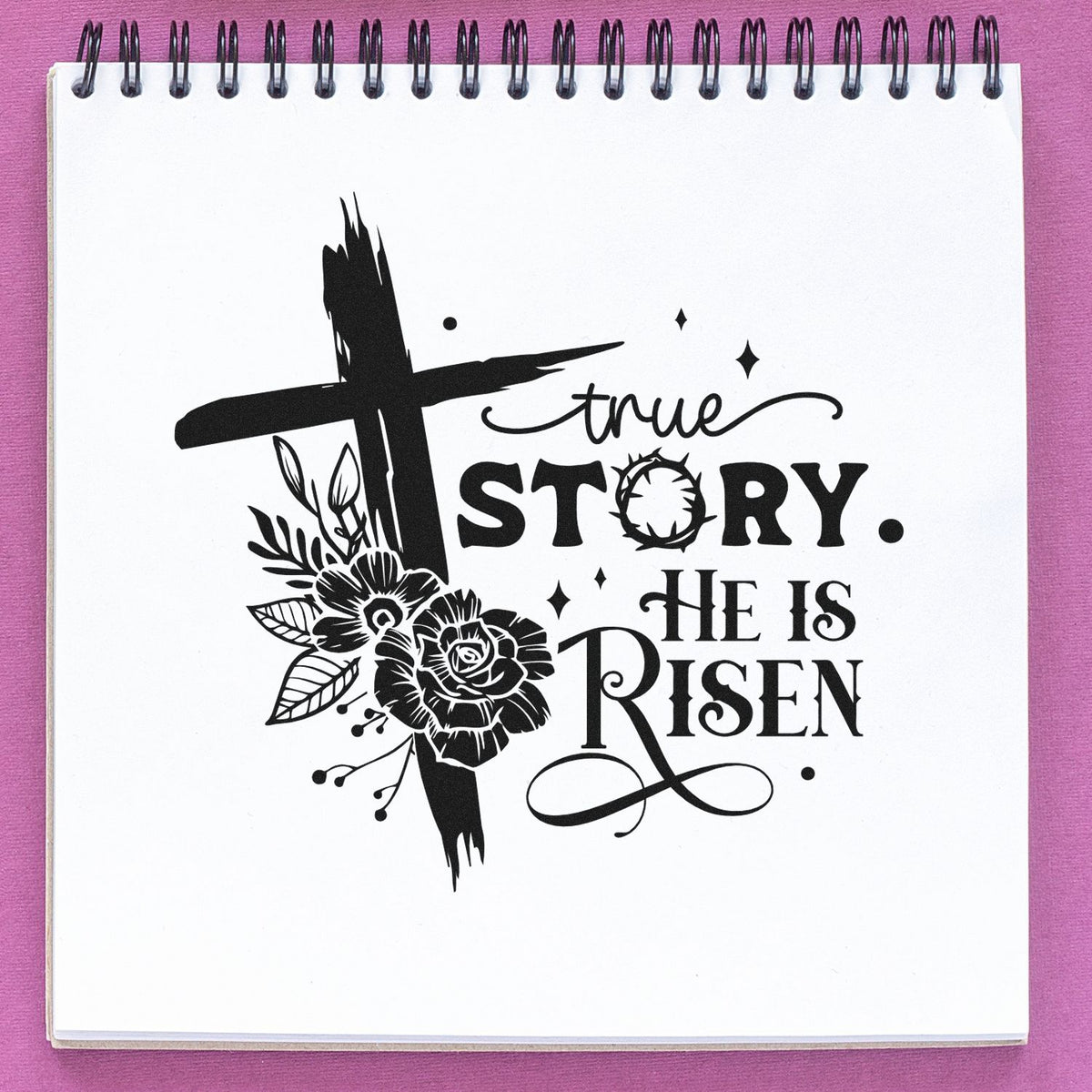 Black religious stamp with floral cross and true story. He is Risen on white paper, set against a purple background.