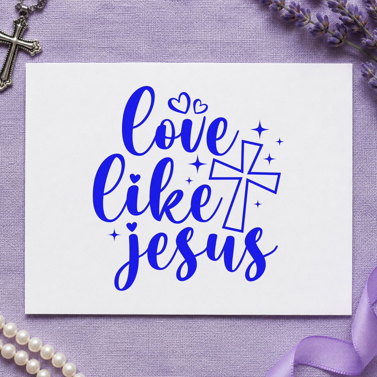 Love Like Jesus craft stamp imprinted in blue ink on paper, a design suited to canvas totes.