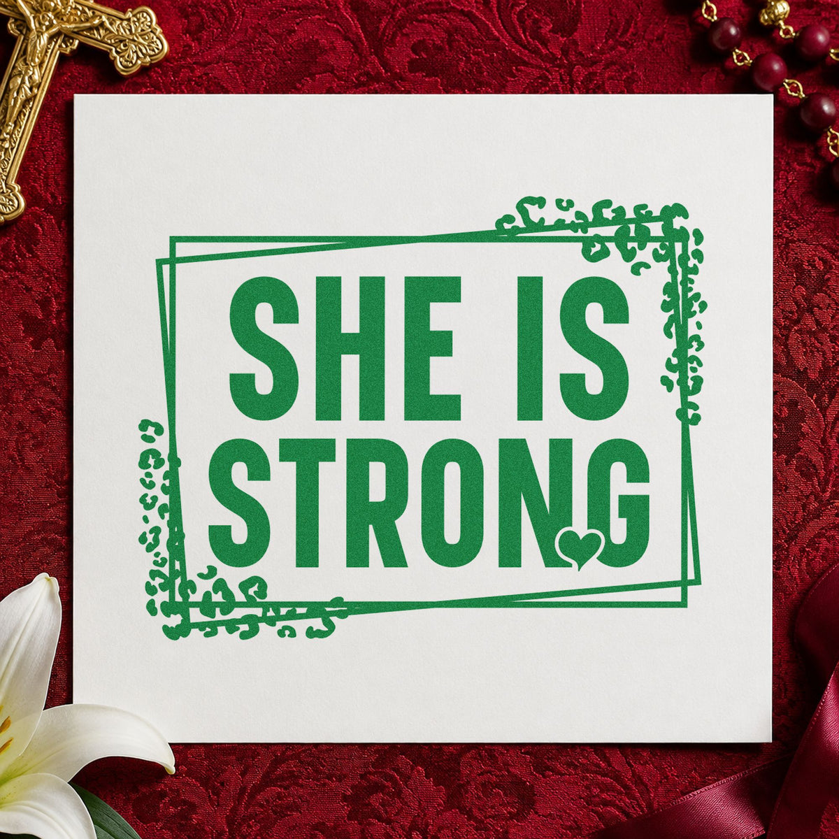 She Is Strong craft stamp imprint in green ink on a handmade project, one idea being single mom notes.