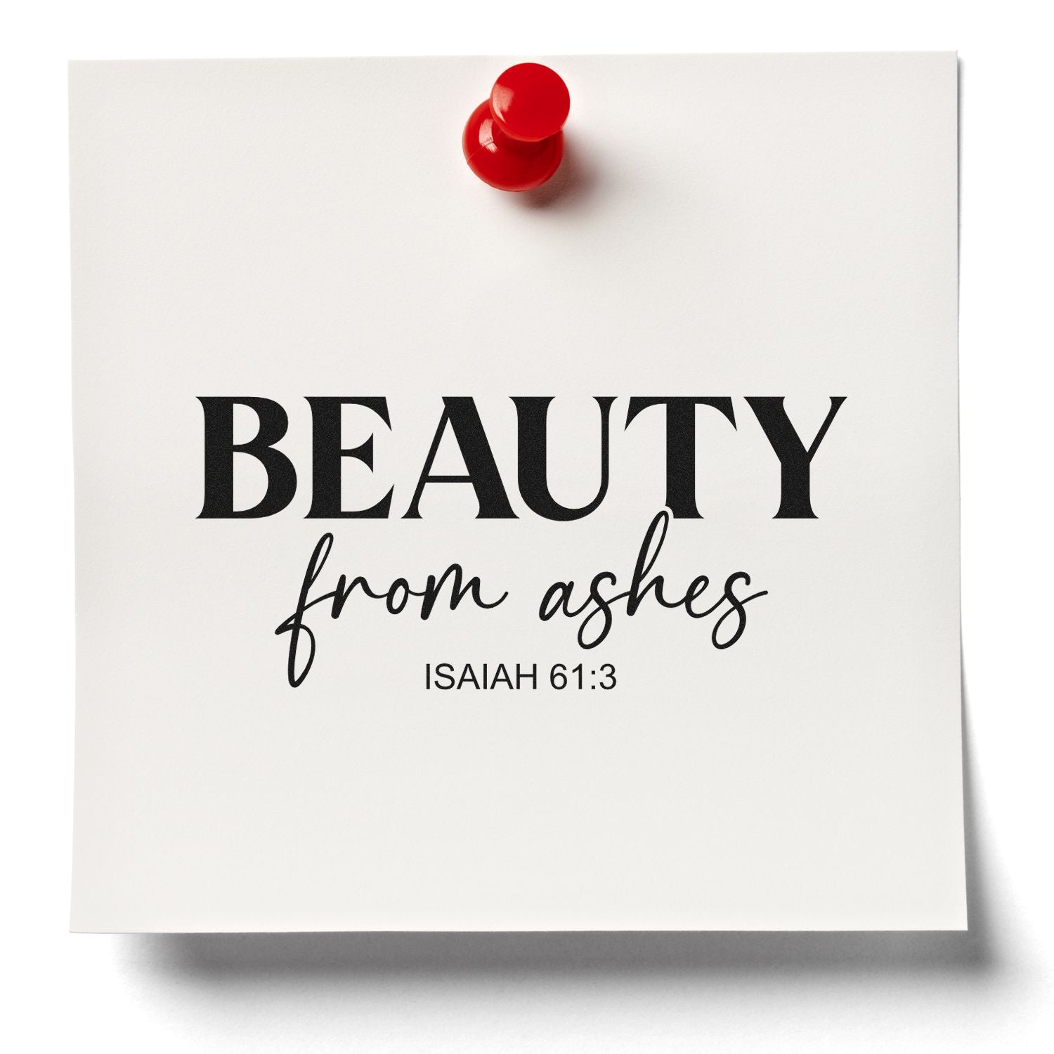 White paper with red seal-style pushpin and black stamped text: BEAUTY from ashes Isaiah 61:3.