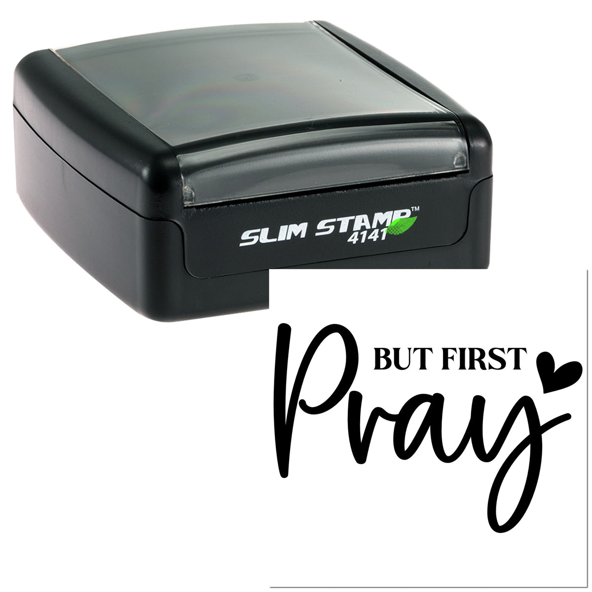 Black slim self-inking stamp and seal with clear cover, showing But First Pray in bold script.
